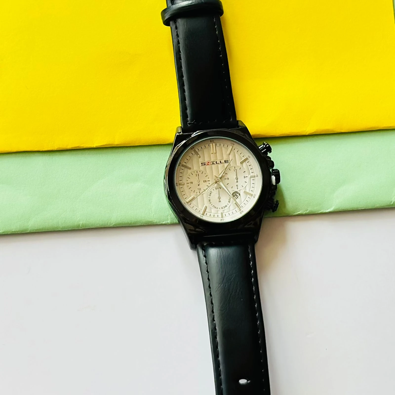 Forest quartz analog watch with a gold-tone mesh strap and a white dial.
