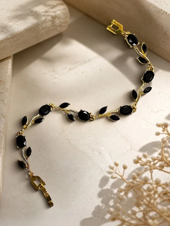 Breslet features black crystal leaf stones on a silver-toned metal chain