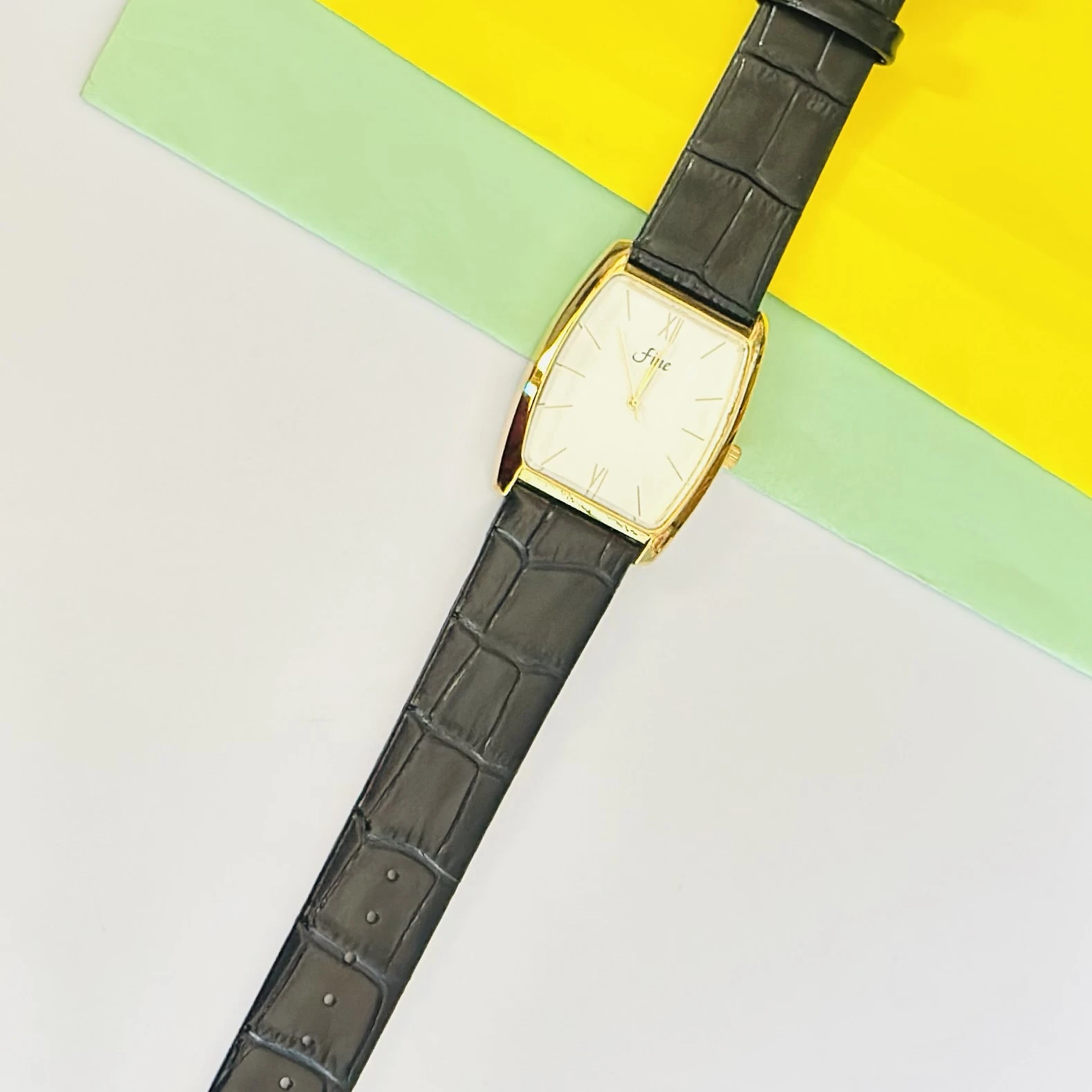 Edge quartz analog white dial black leather strap watch.