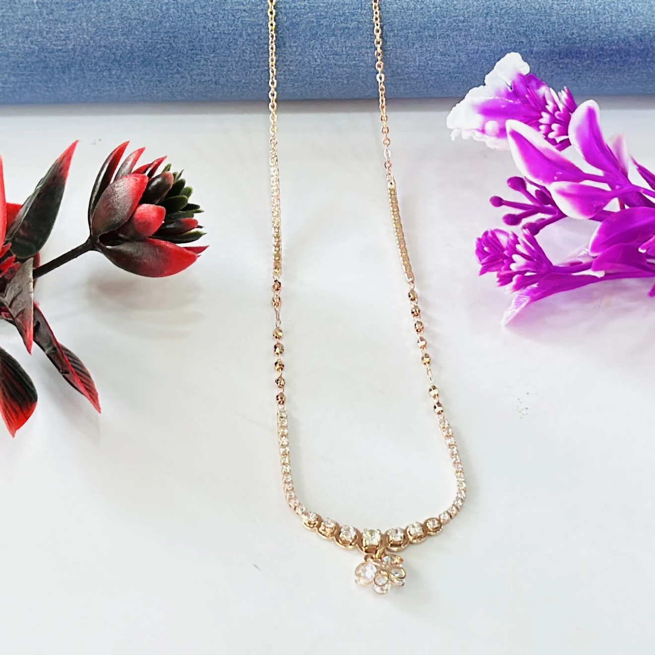 Rose gold-plated sterling silver chain with a flower pendant