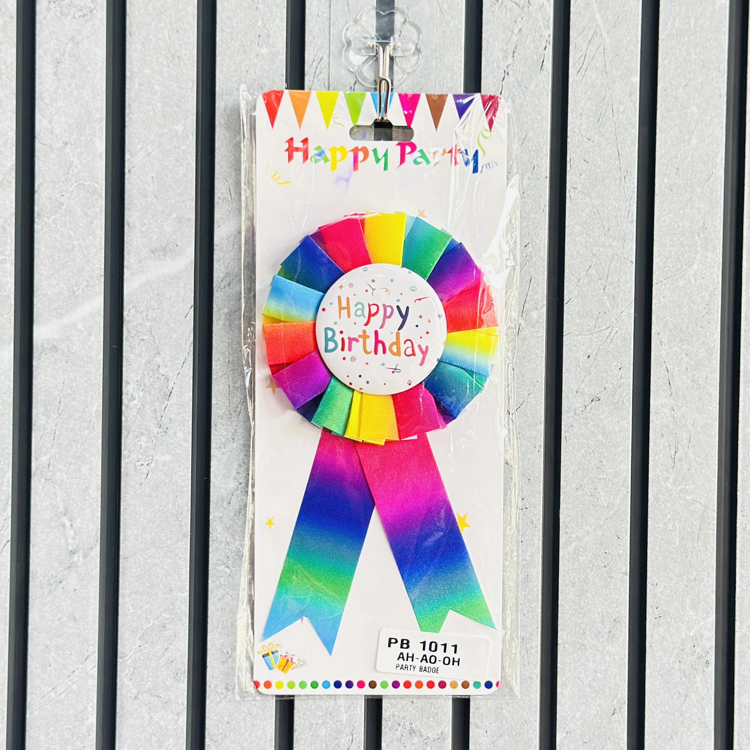 Happy Party brand Rainbow Happy Birthday rosette badge.