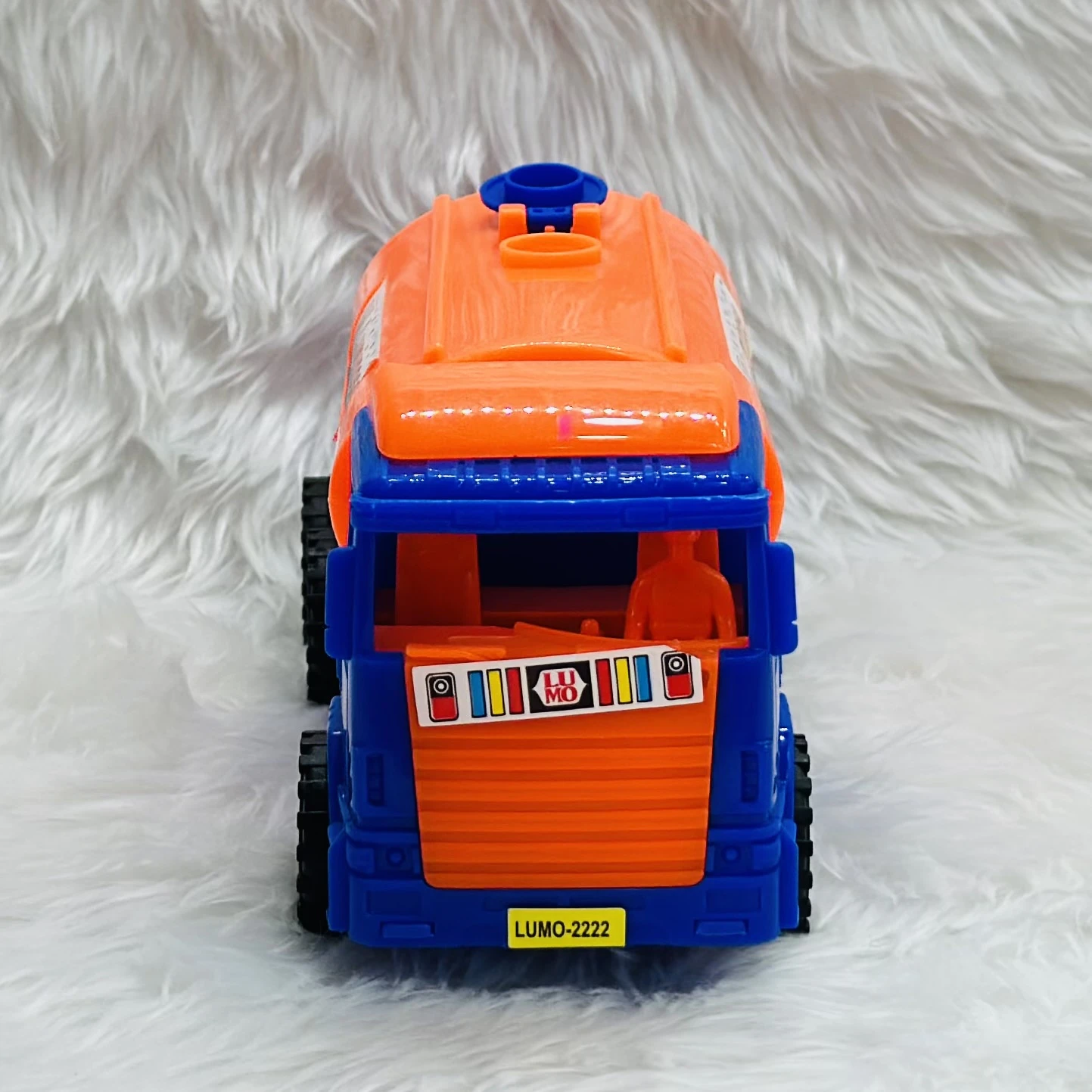 Luminoso brand friction-powered oil tanker truck toy.