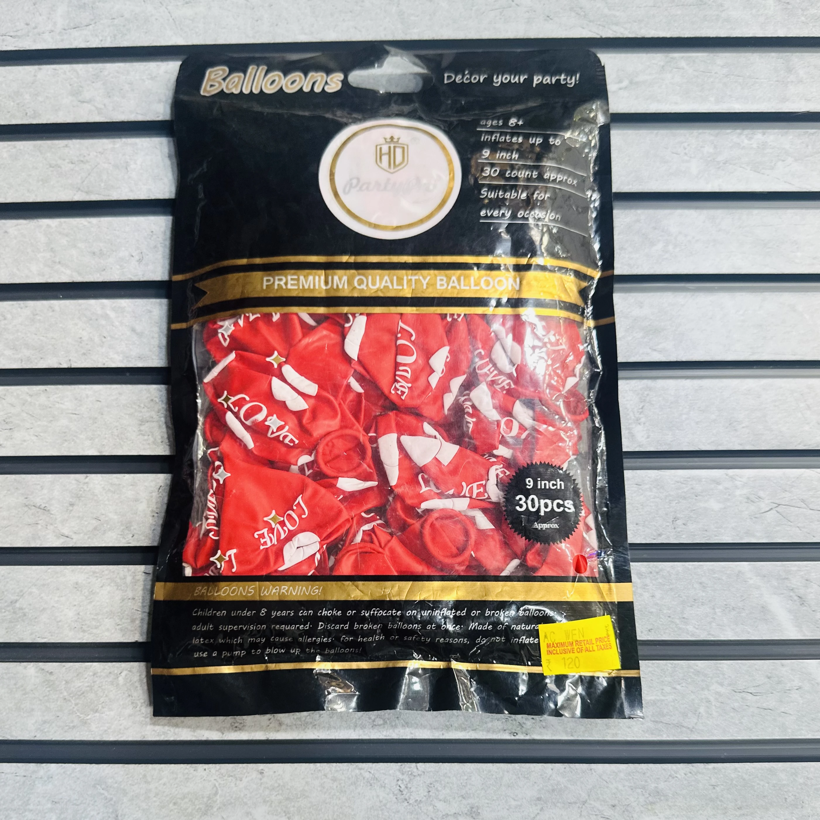 package of red "LOVE" balloons.
