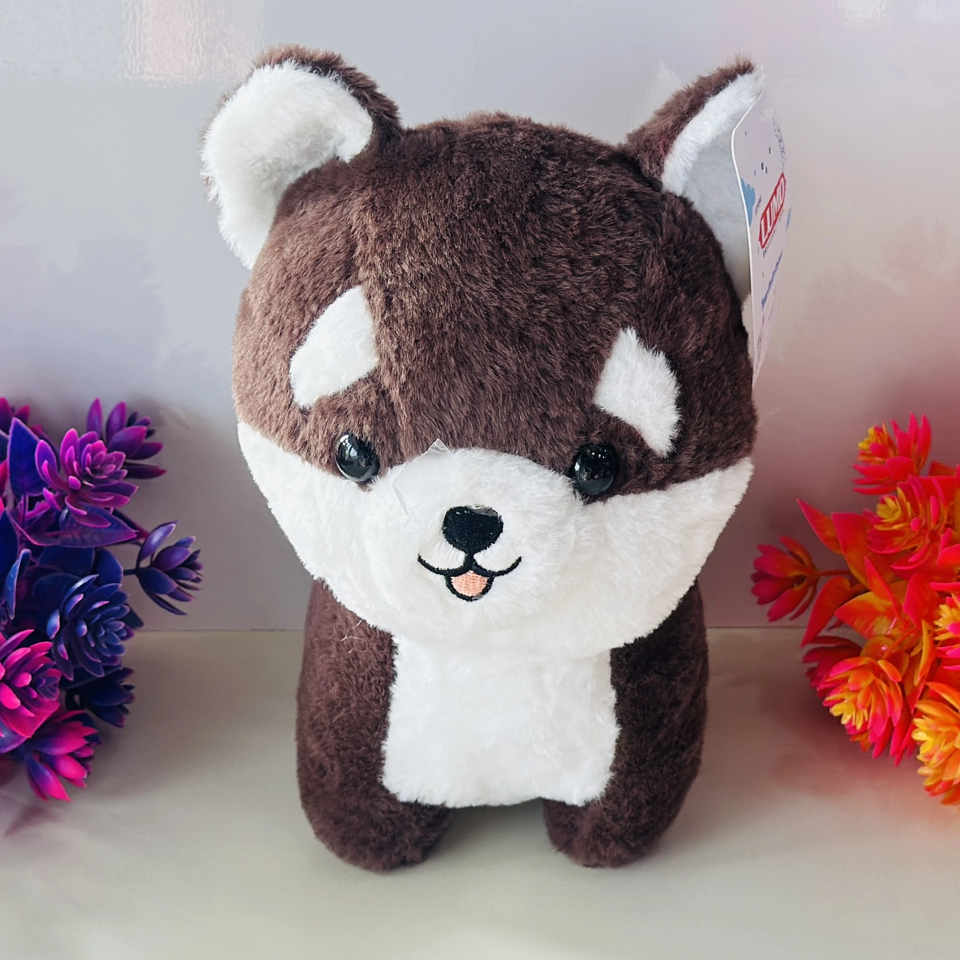 Brown and white Husky or Shiba Inu dog plush toy.