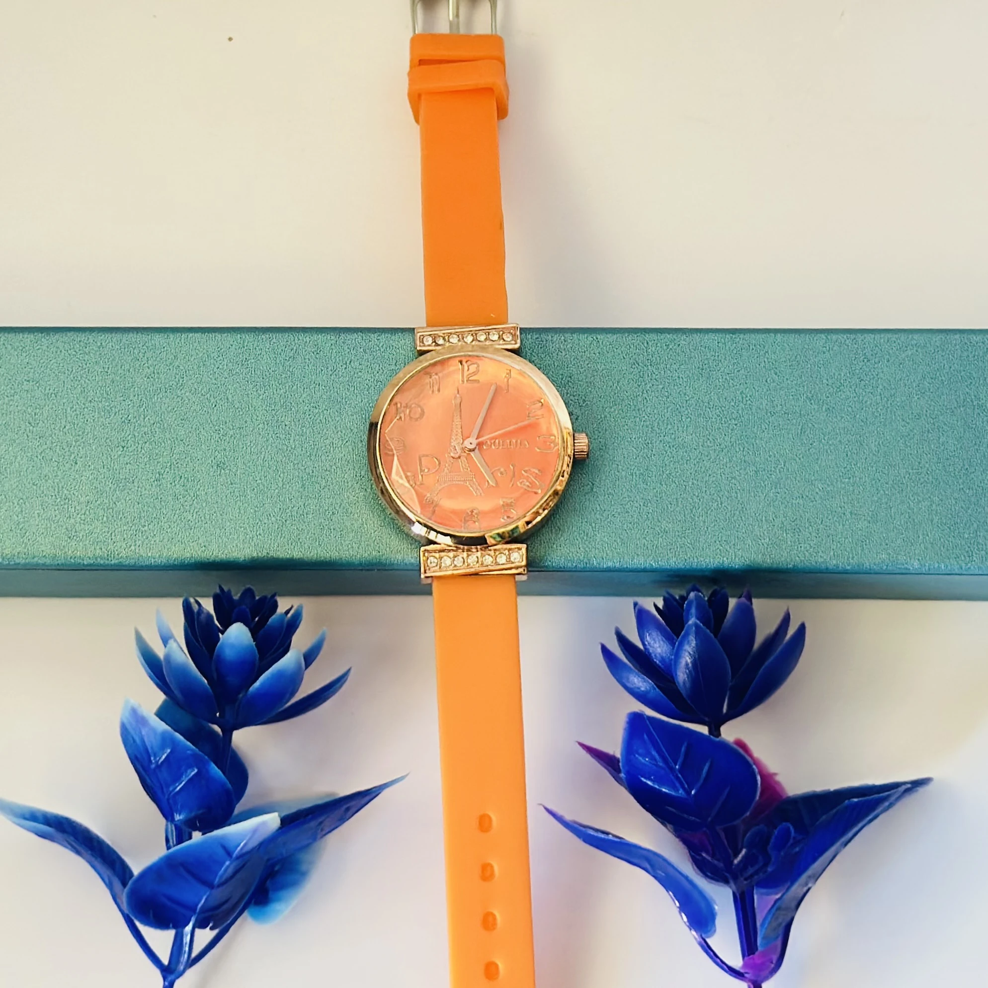 Women's Metal Analog Watch with an orange silicone strap