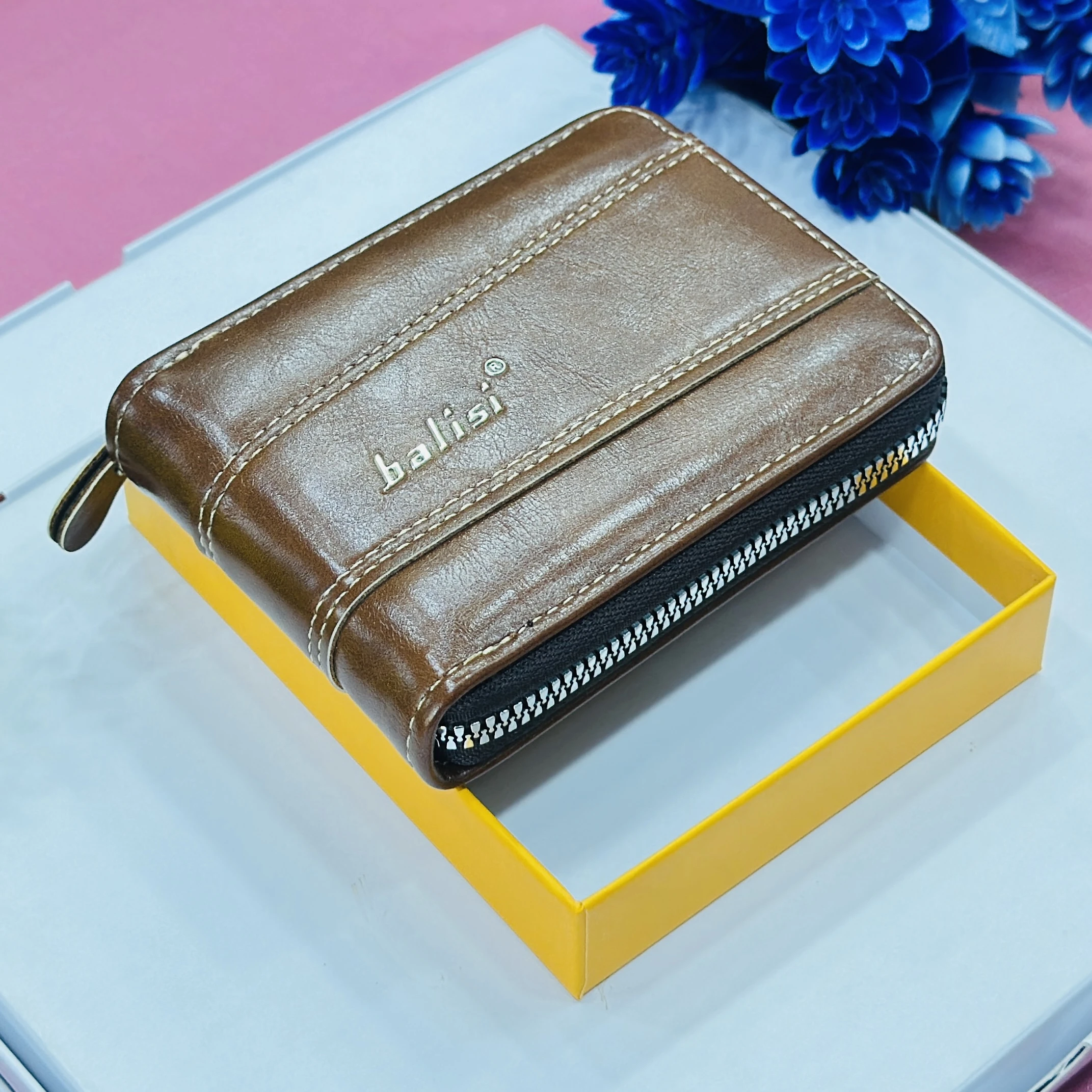 Balisi brand men's wallet is a brown zip-around PU leather wallet.