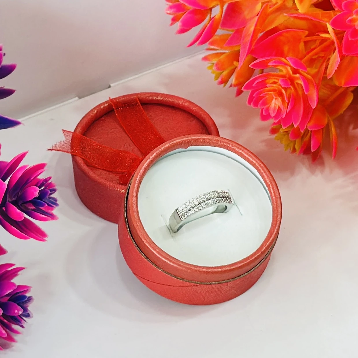 Silver multi-row American diamond band ring.