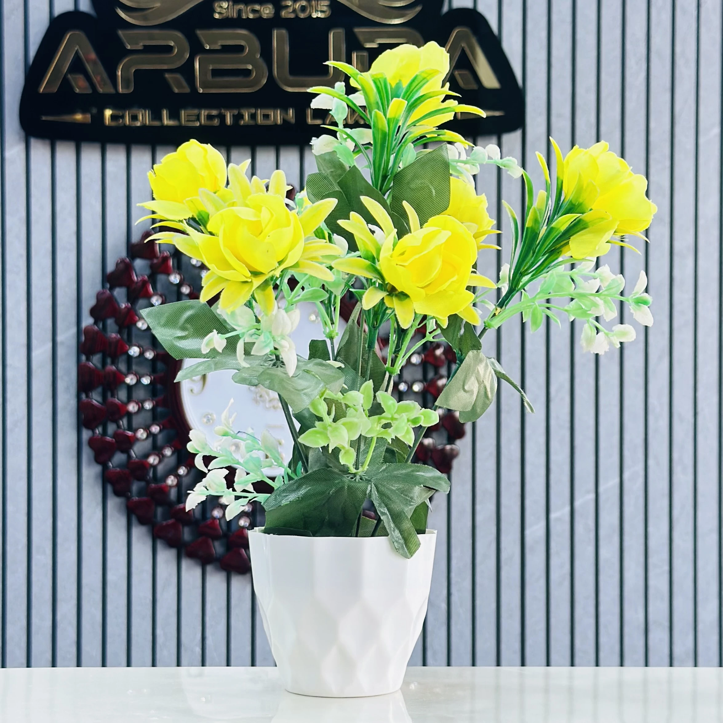 plant for decoration with yellow flowers and a white pot.