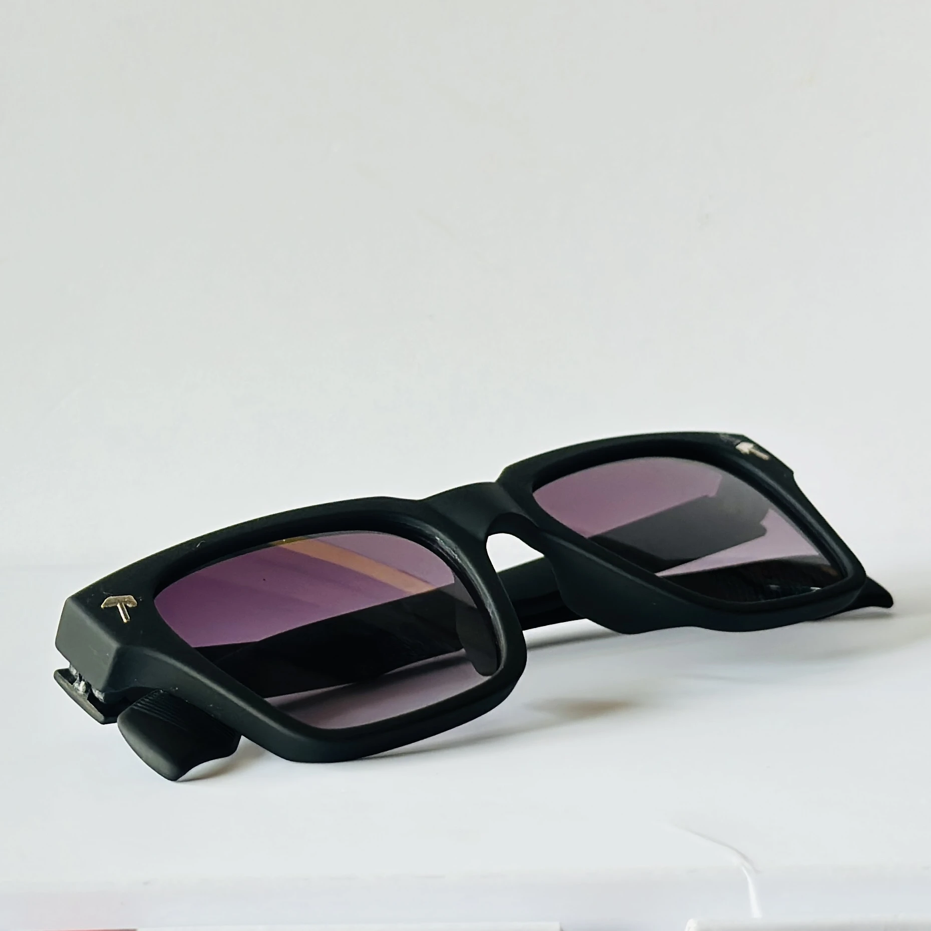 Black sunglasses appear to be the Tommy Hilfiger ML6012 model featuring gradient lenses