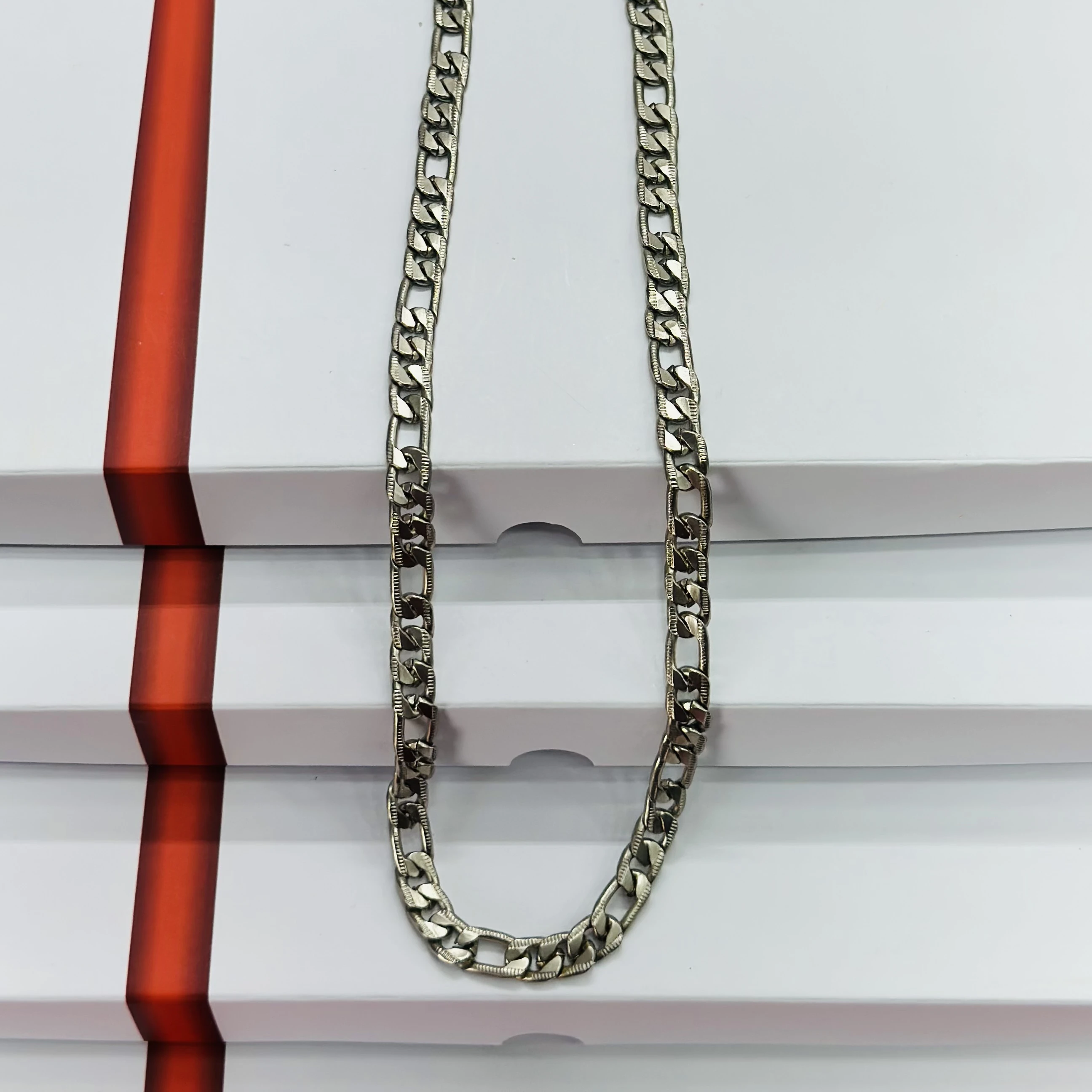 Silver toned metal curb chain