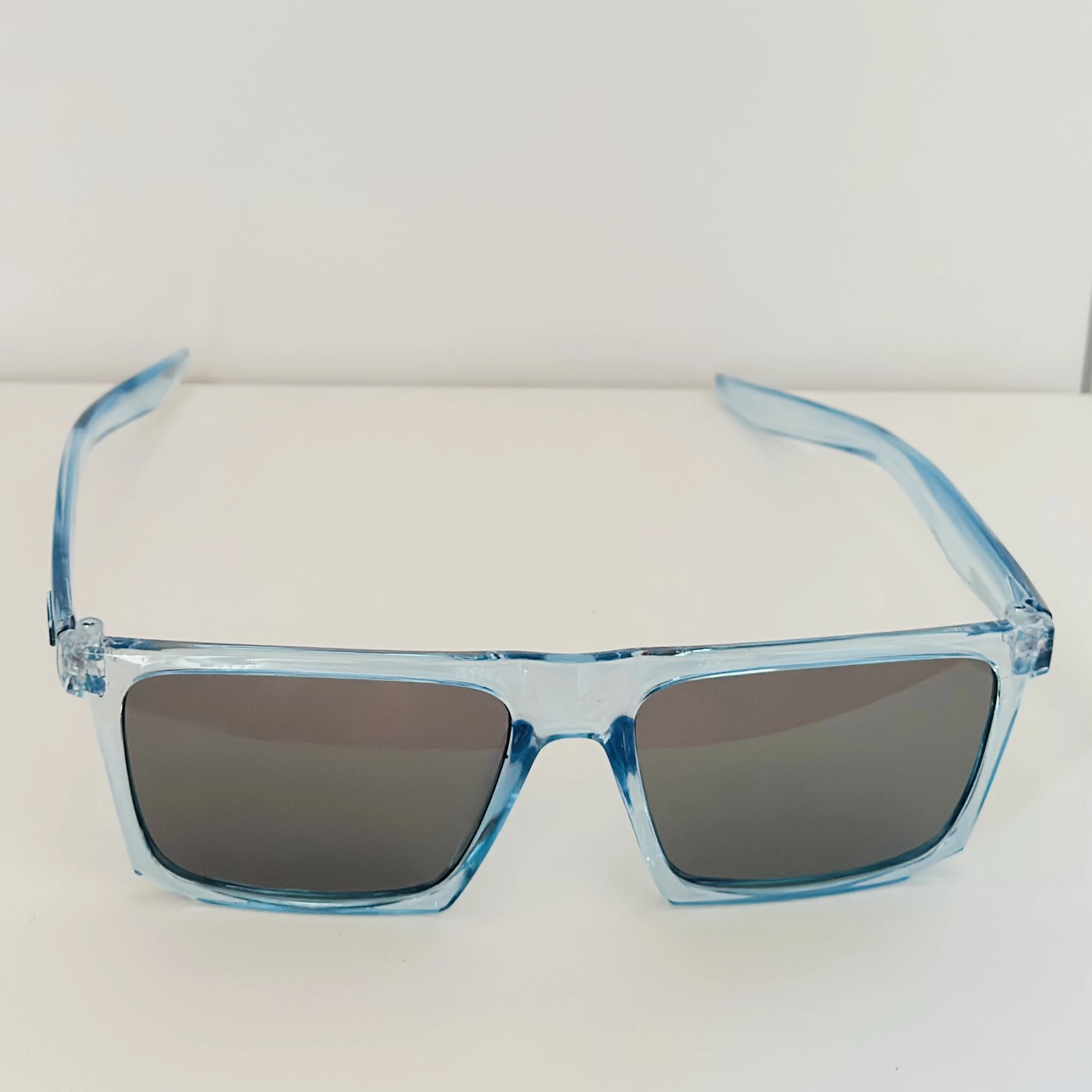 Voyage polarized sunglasses with a blue frame and black lenses.