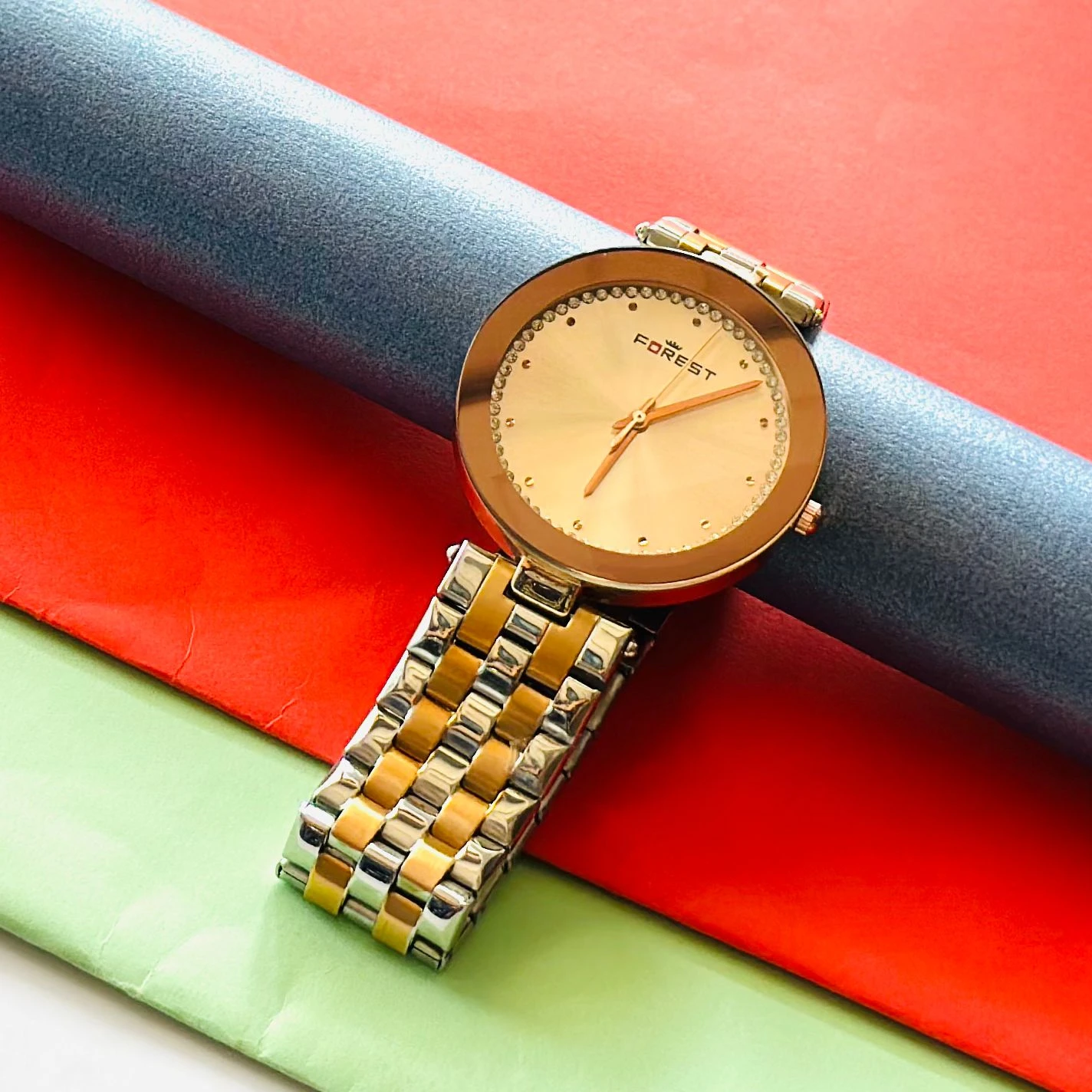 Forest women's watch with a round, gold-tone case