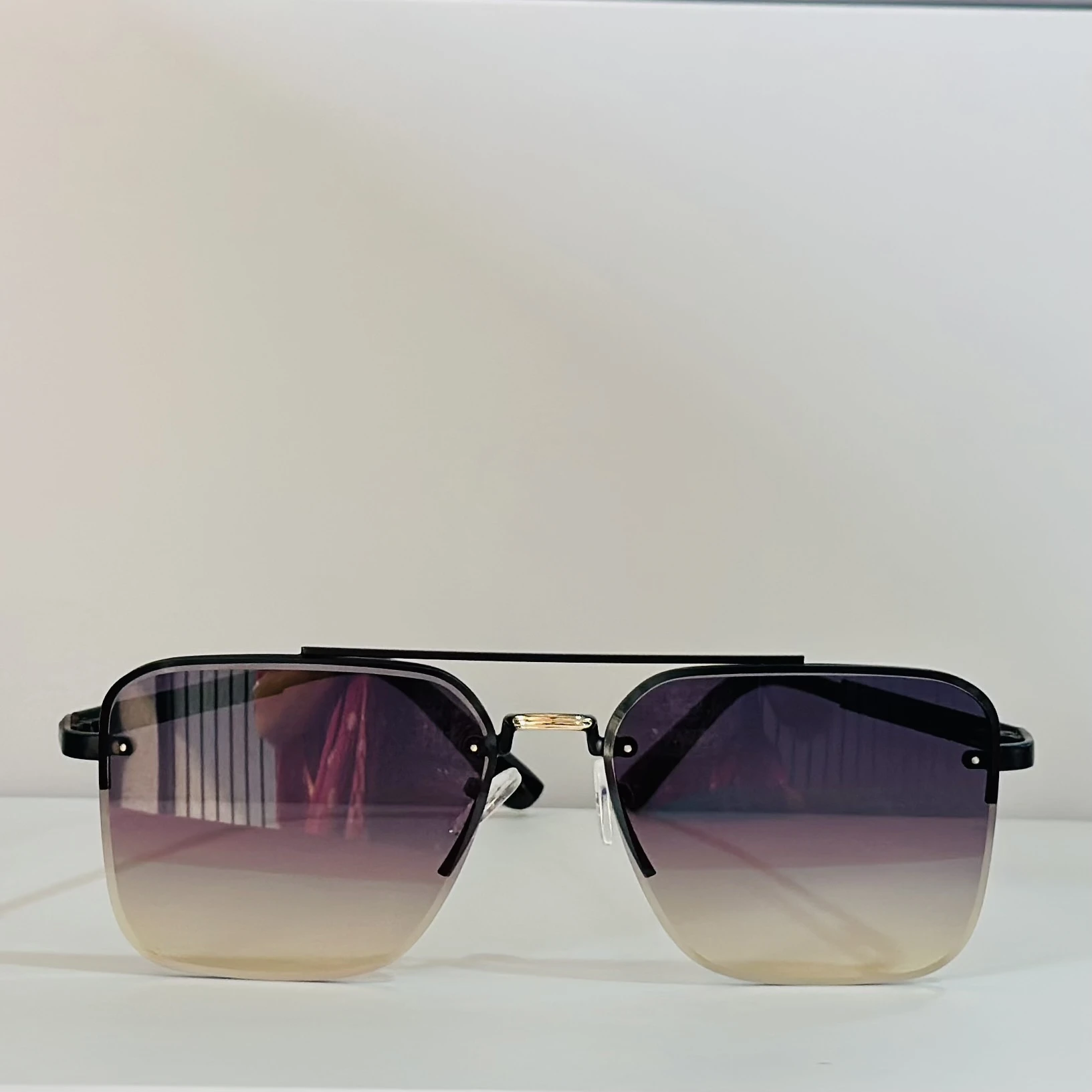 pair of Sam & Marshall Dario sunglasses with black frames and gradient lenses.