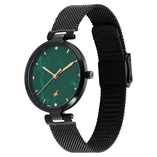 Fastrack Stunners X analog watch, featuring a striking green mother-of-pearl dial paired with a dark mesh stainless steel stra