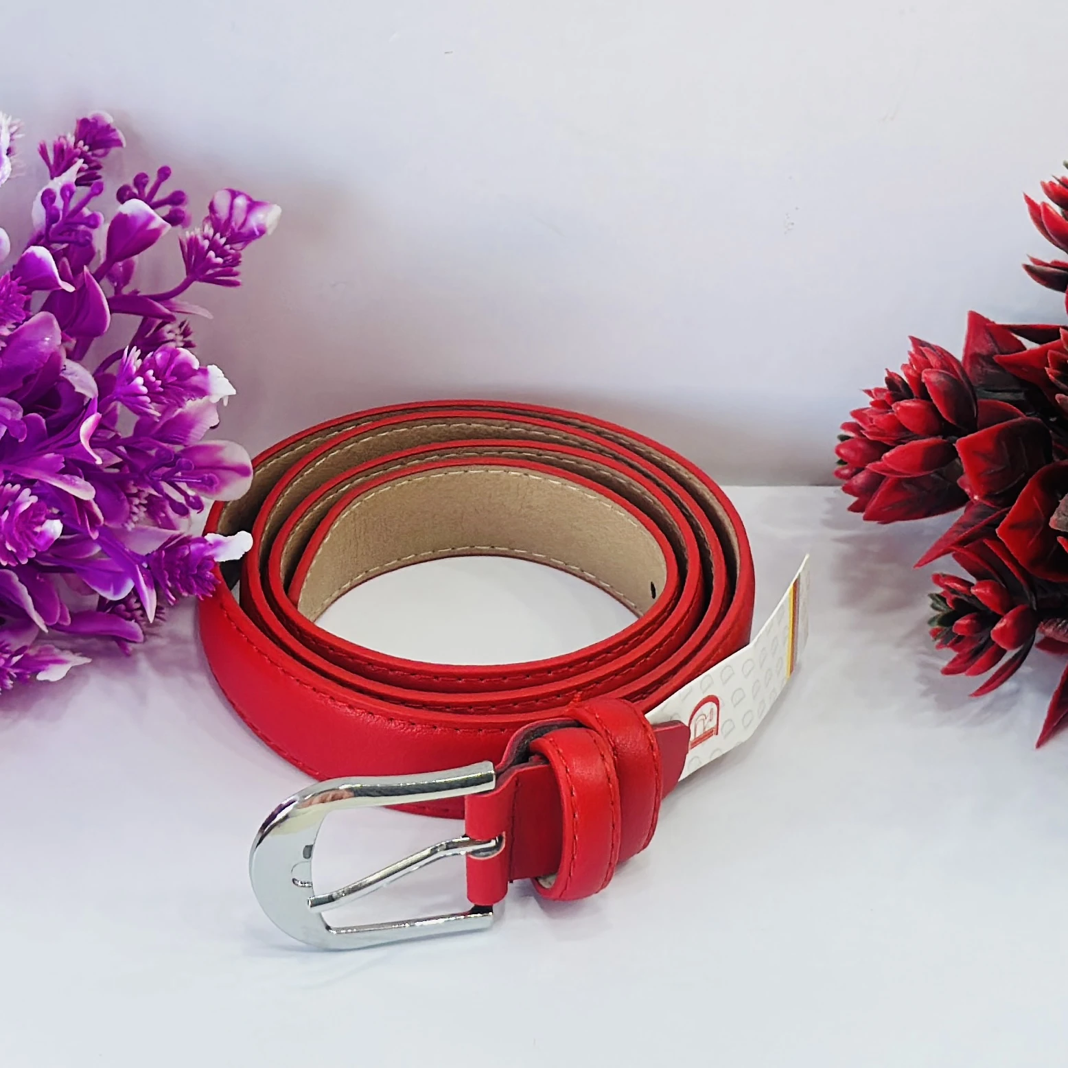 Red leather or polyurethane women's dress belt