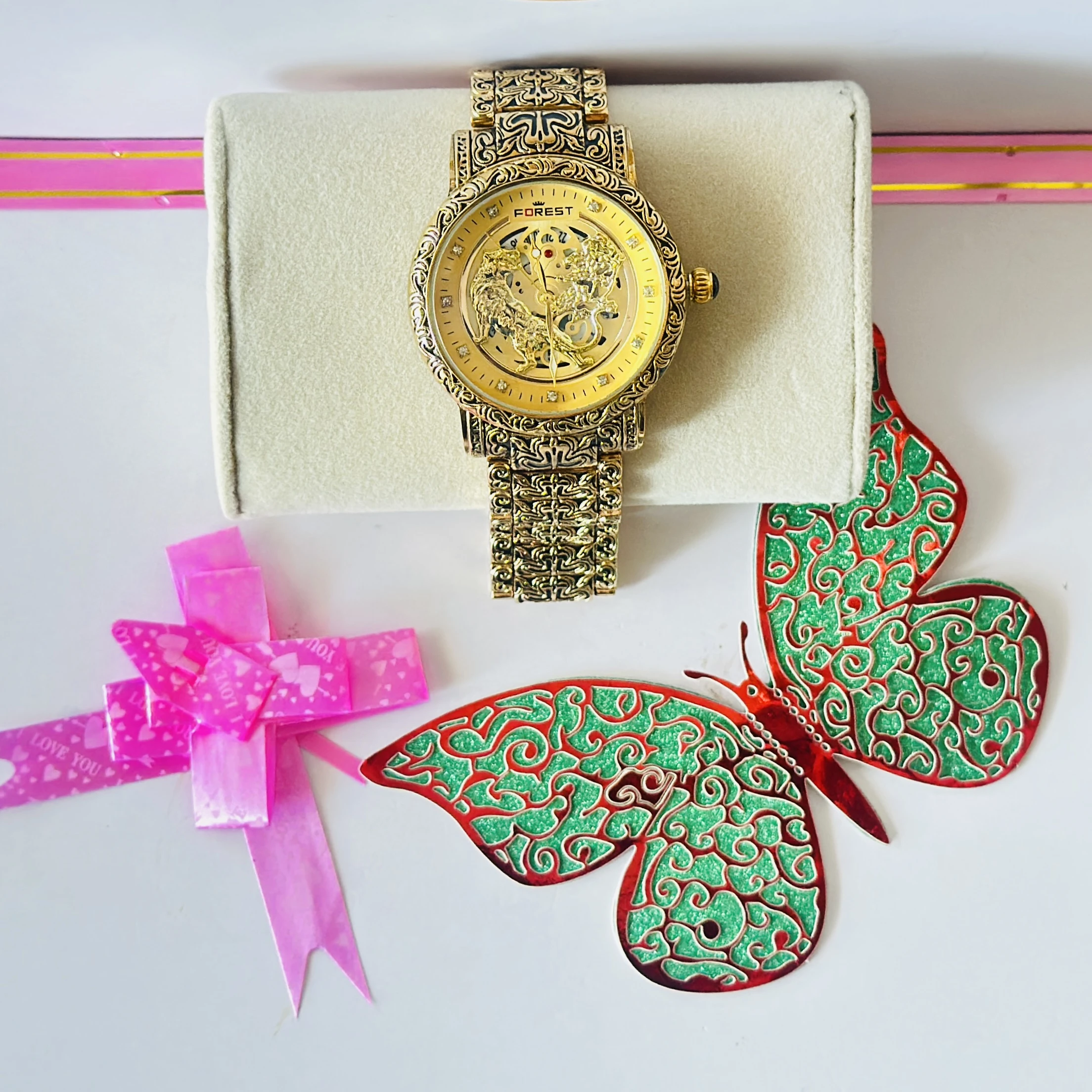 Forest Luxury Gold-Tone Tiger Skeleton Dial Watch with an engraved pattern band.