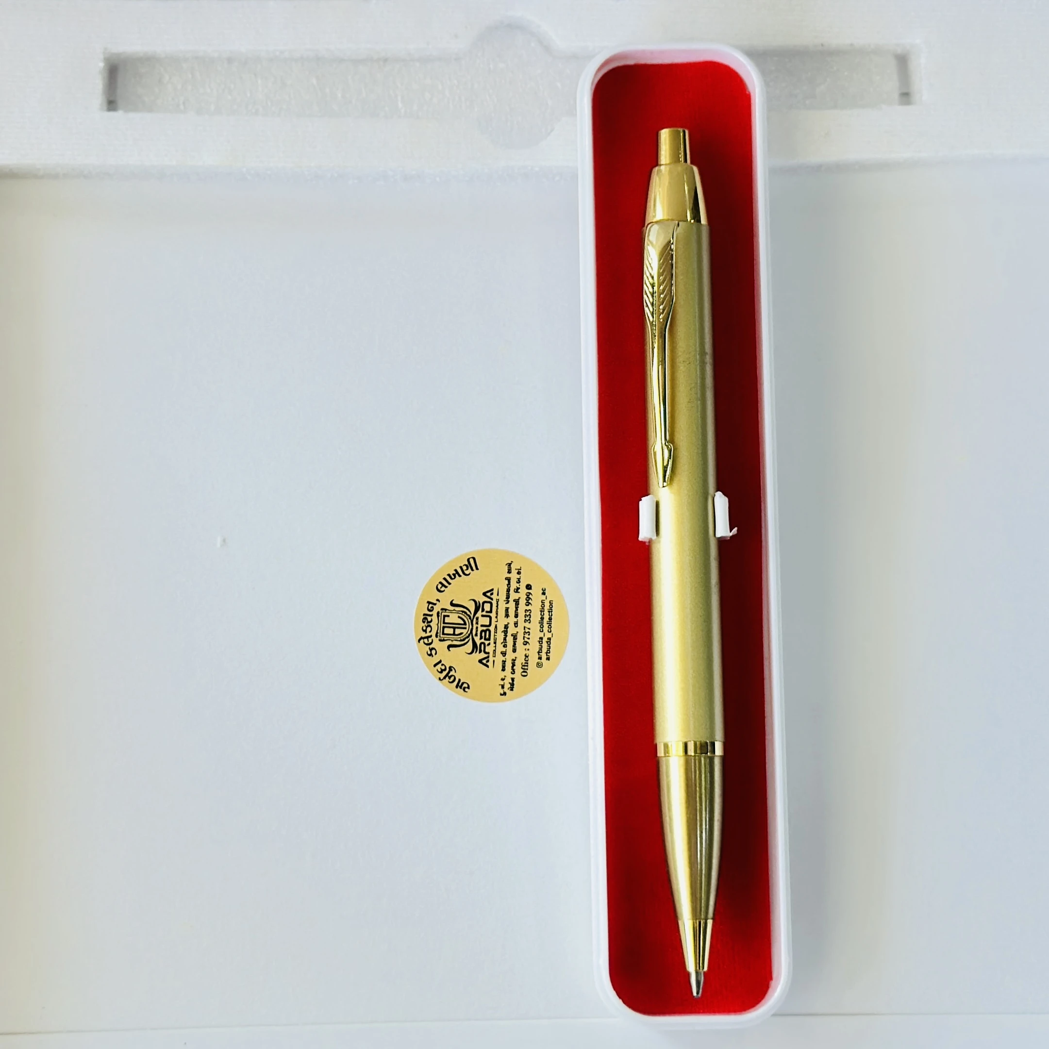 Gold colored metal click ballpoint pen.