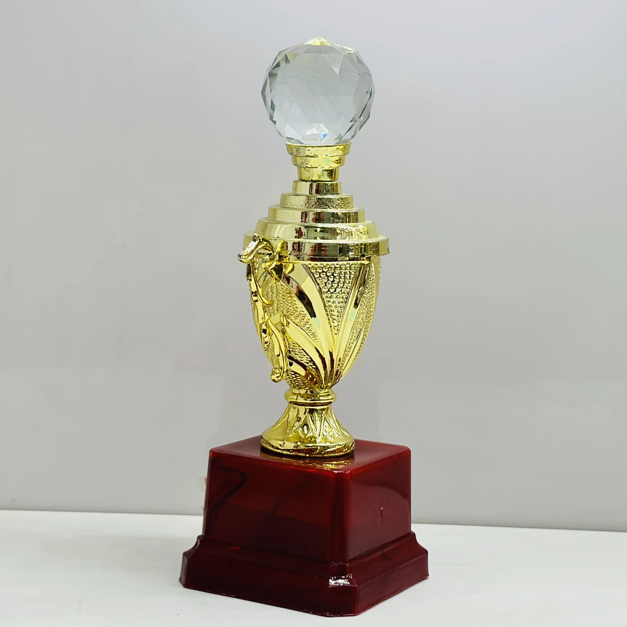 cricket trophy featuring a batsman figure.