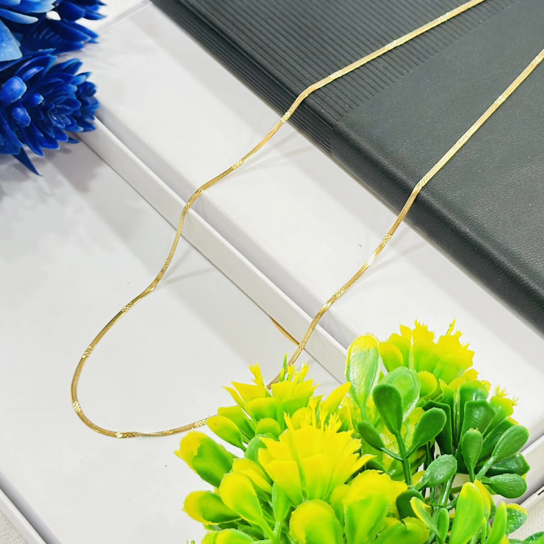 premium gold-plated herringbone snake chain.
