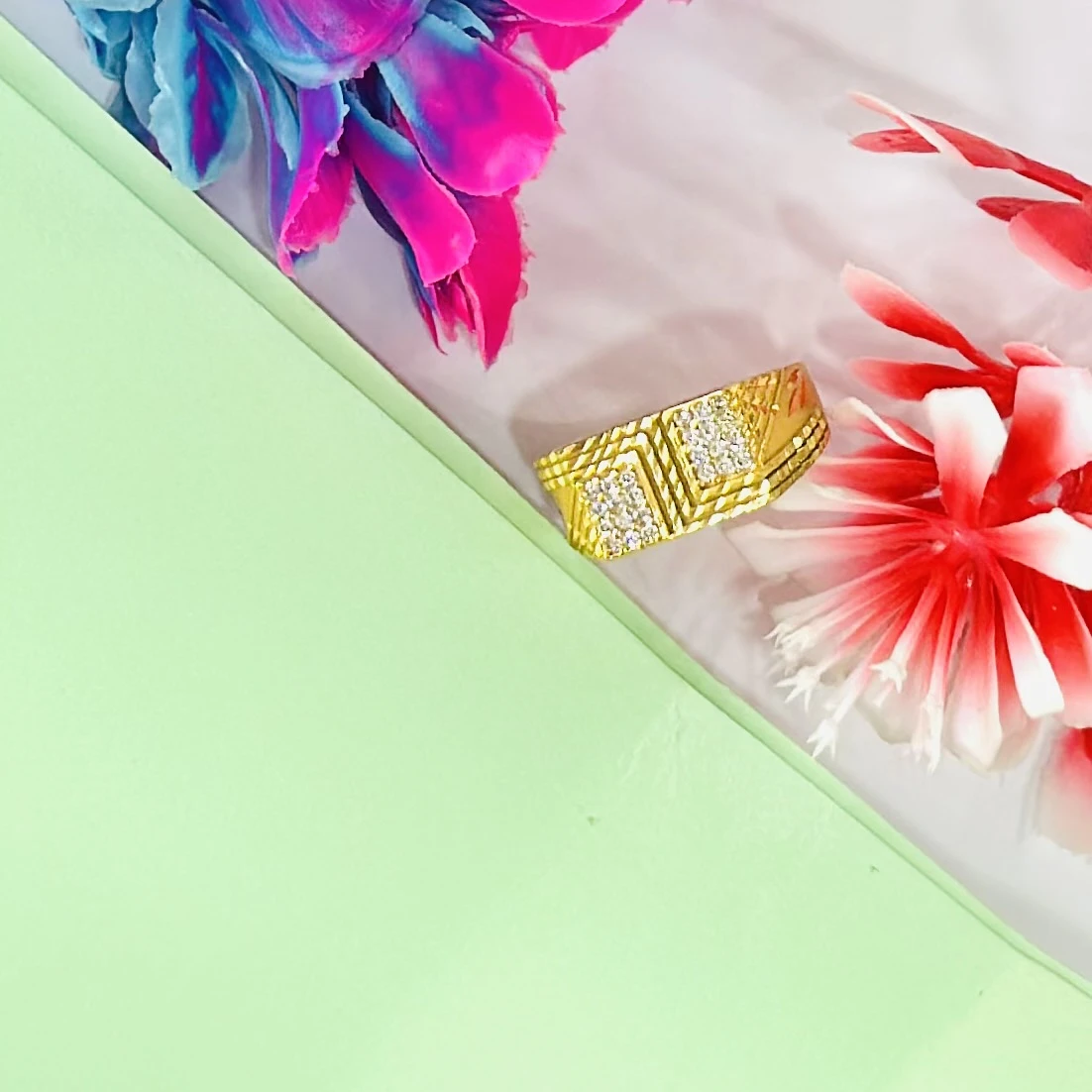 gold-plated, cubic zirconia-studded brass ring for men.