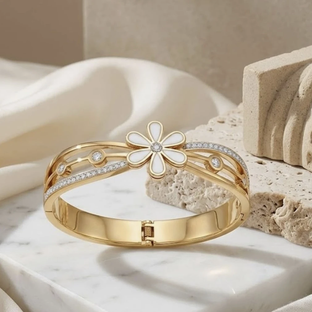 Gold tone hinged bangle bracelet
