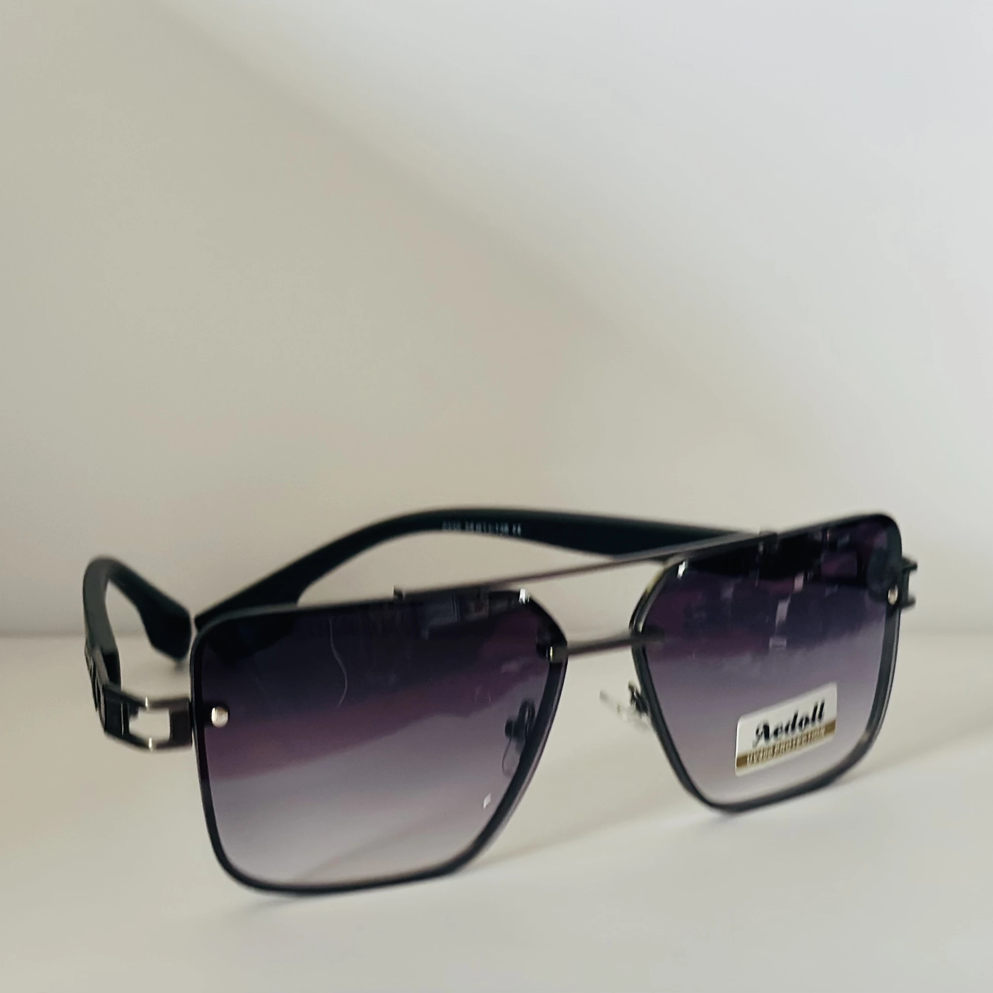pair of Aedoll Goggle sunglasses with a gold metal frame and pink gradient lenses.