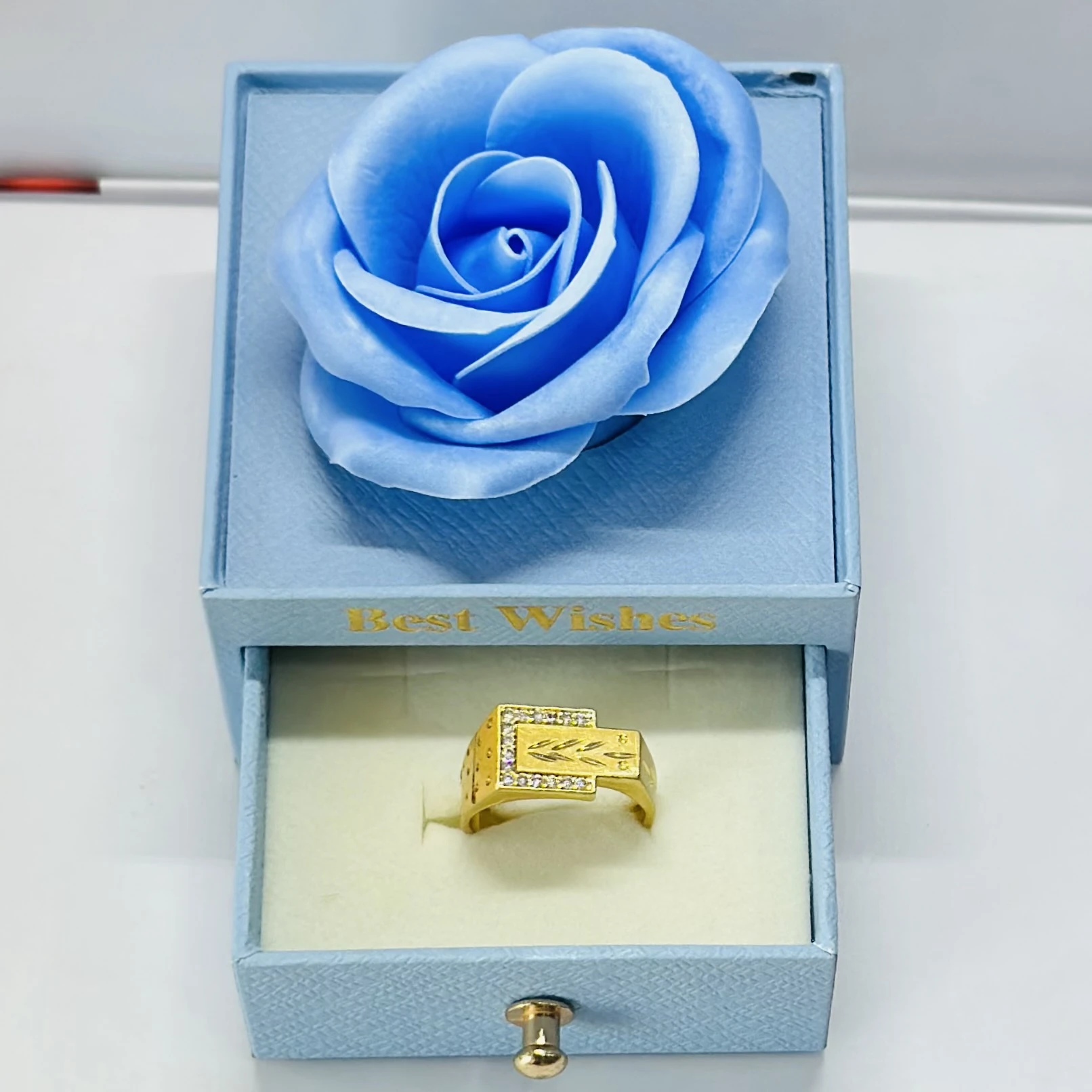 1 gram gold-plated men's ring with a rectangular face and side stone accents