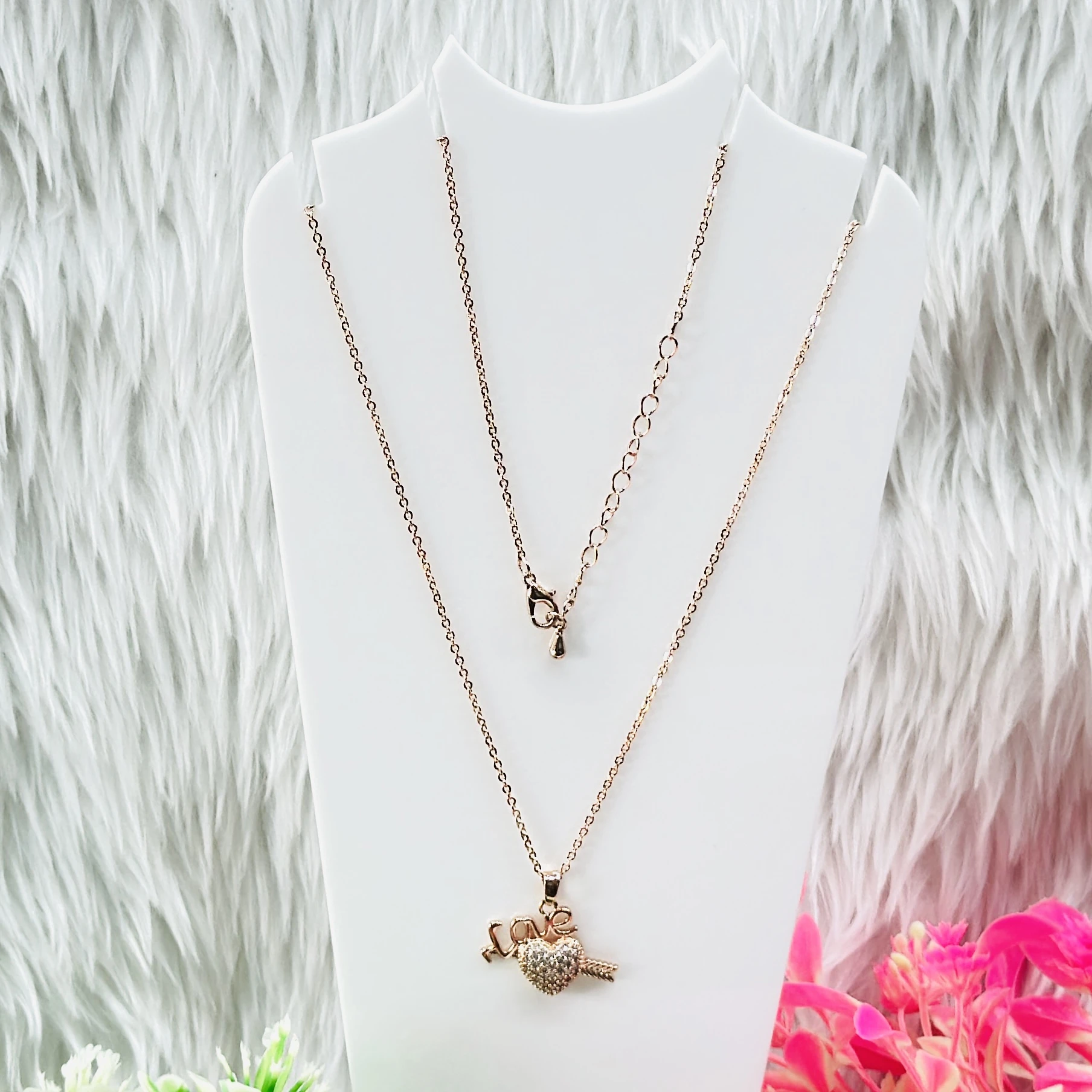Rose gold necklace set features a heart pendant