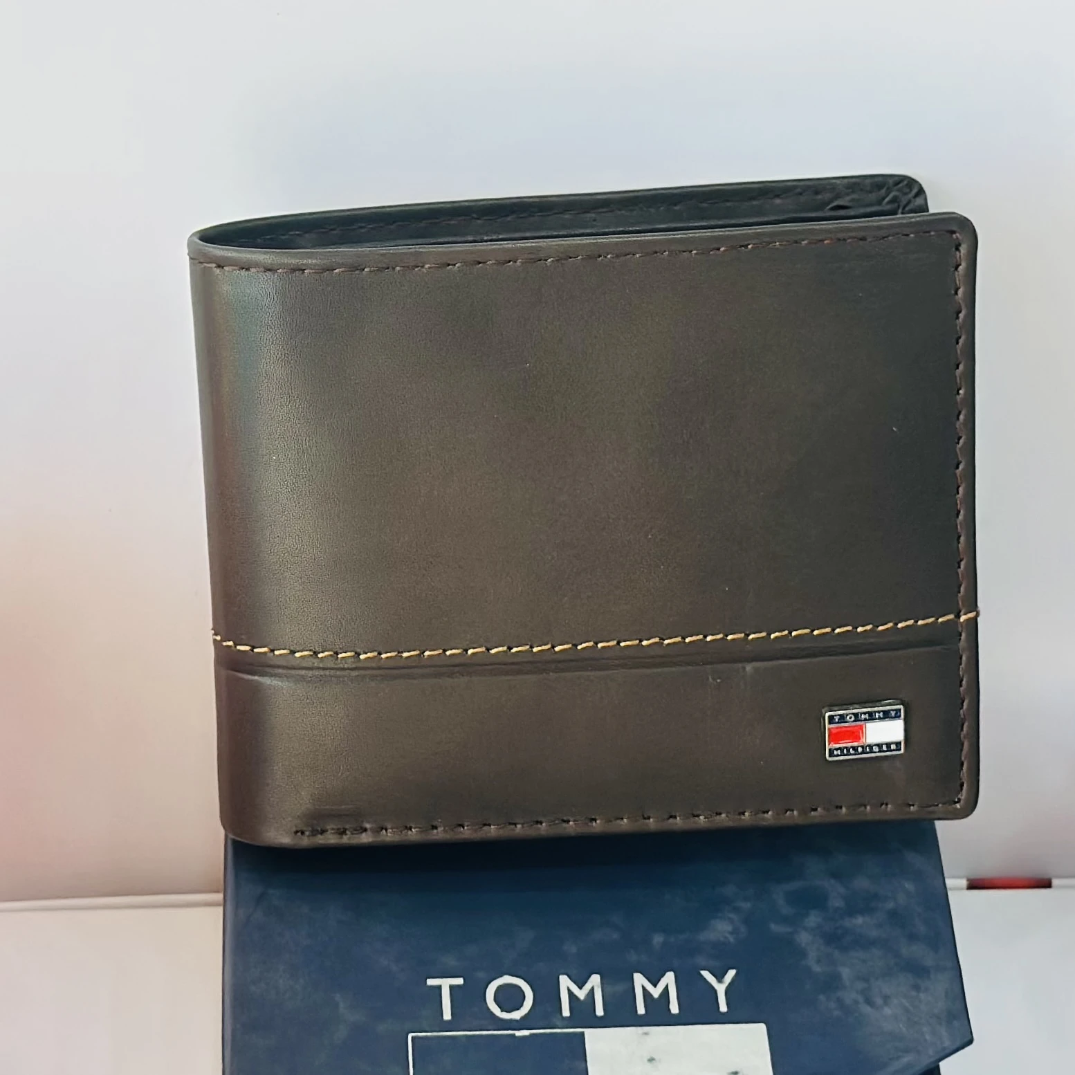 Tommy Hilfiger men's genuine leather bi-fold wallet.