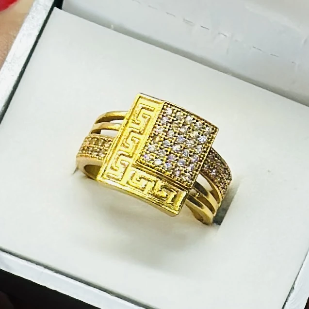 gold Greek Key cube engagement ring with diamonds.