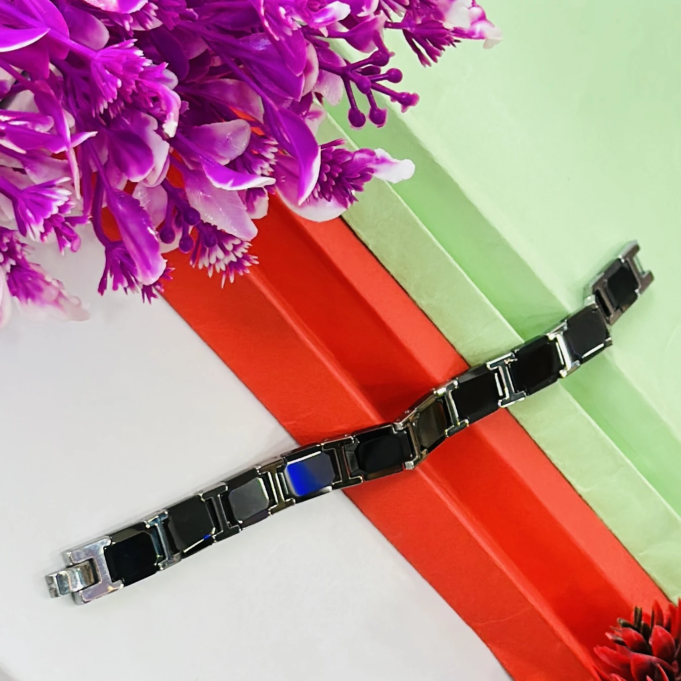 men's stainless steel and black ceramic (or rubber) link bracelet.