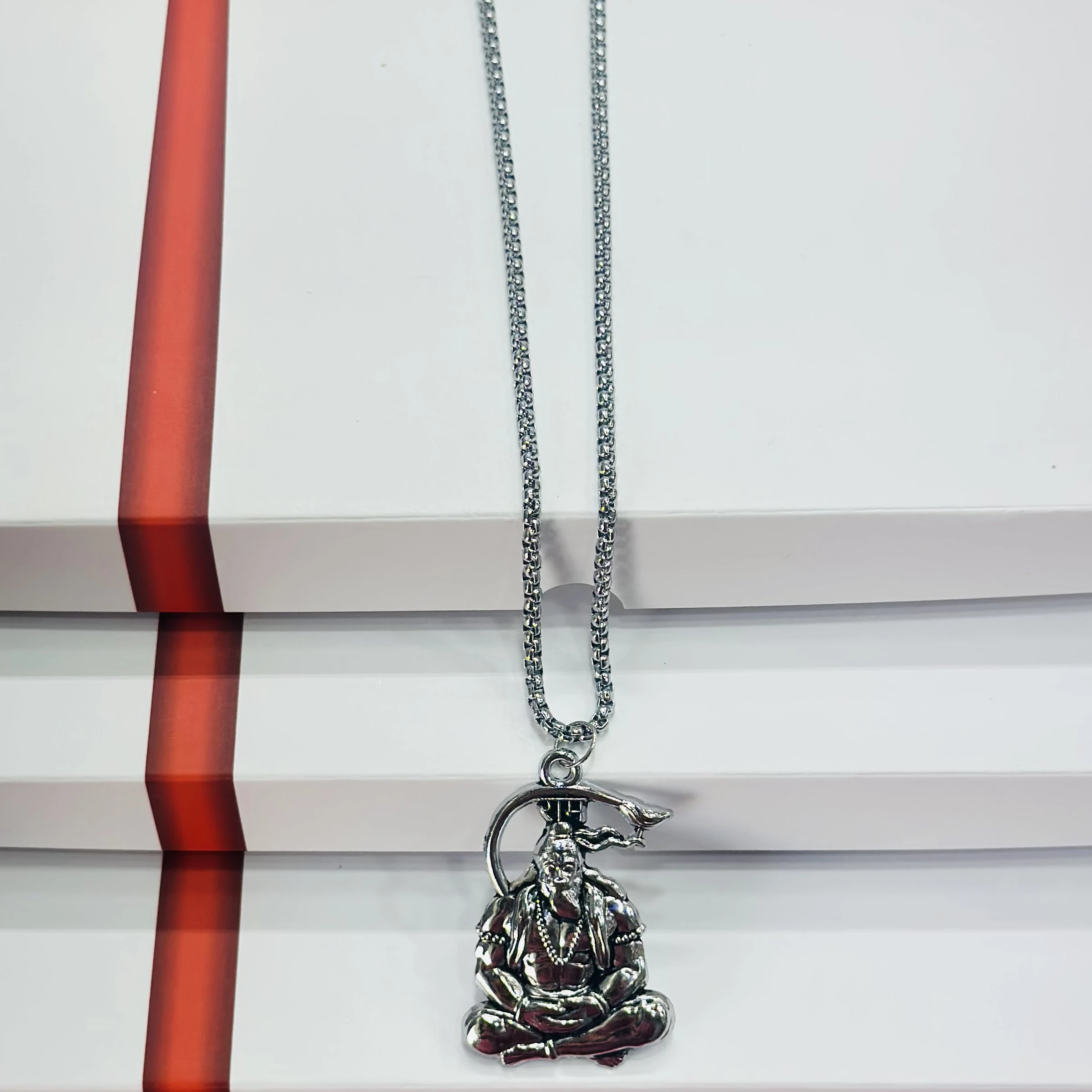 Silver finished Lord Hanuman pendant with a chain.
