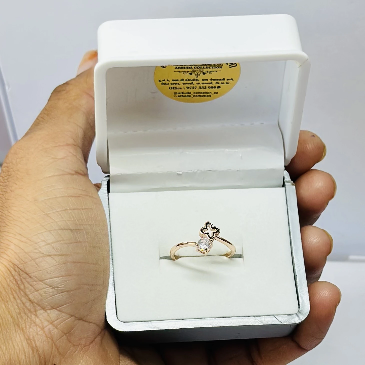 Rose gold-toned clover and diamond ring.