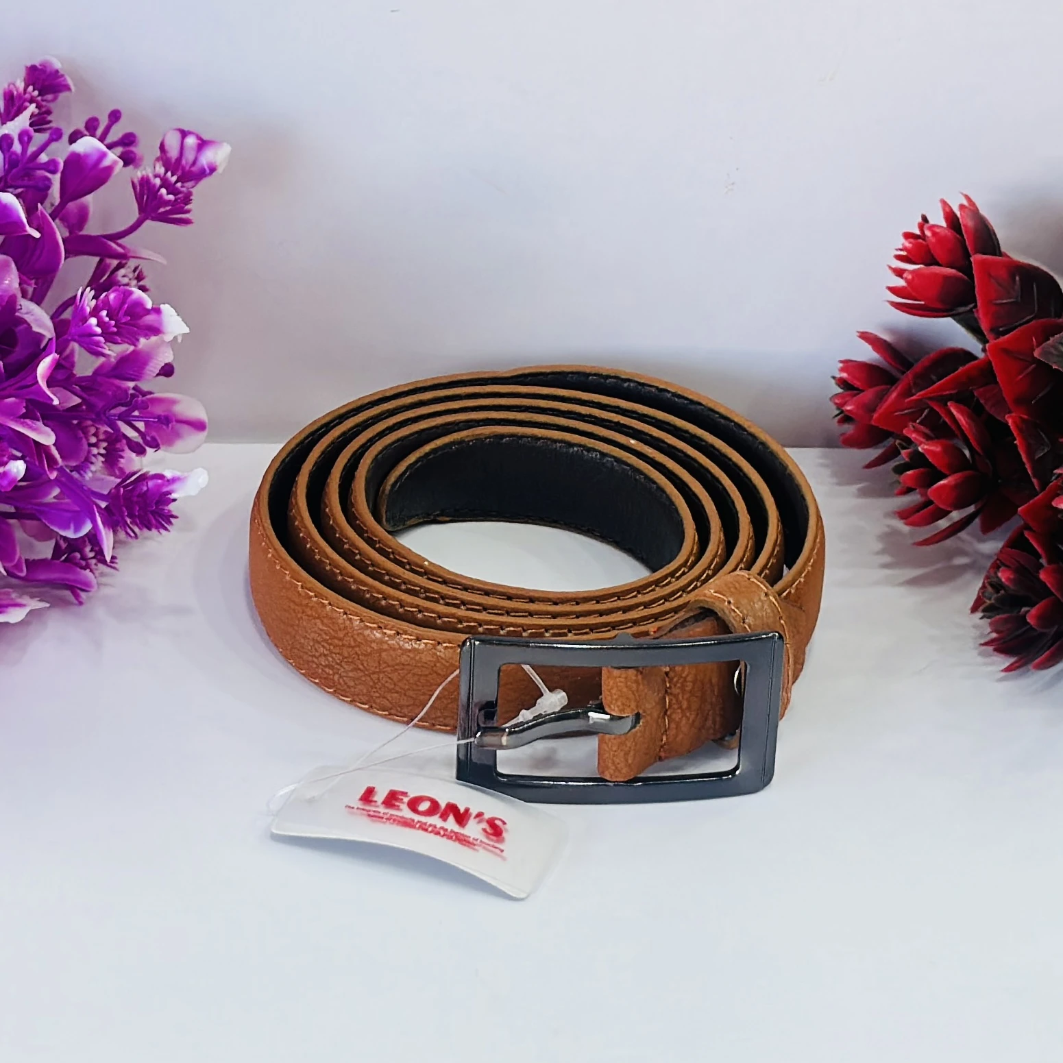 men's tan leather or synthetic leather belt