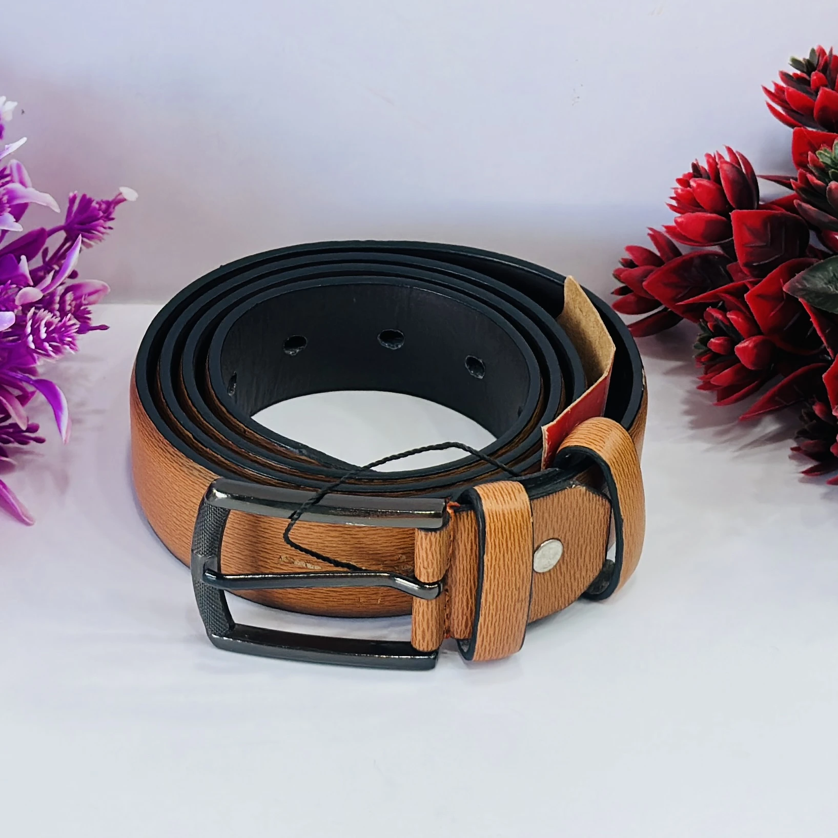 Tan  textured leather belt for men.