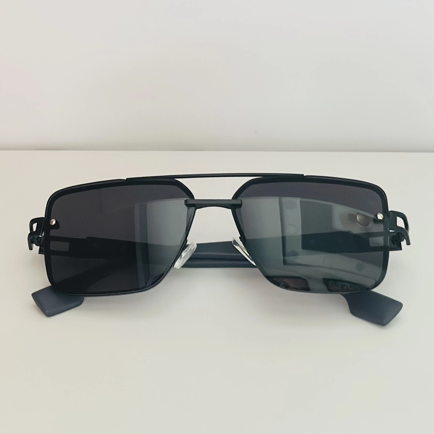 pair of black metal rectangular sunglasses.
