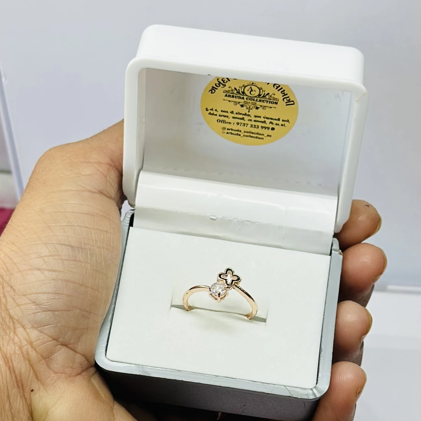 Rose gold-toned clover and diamond ring.