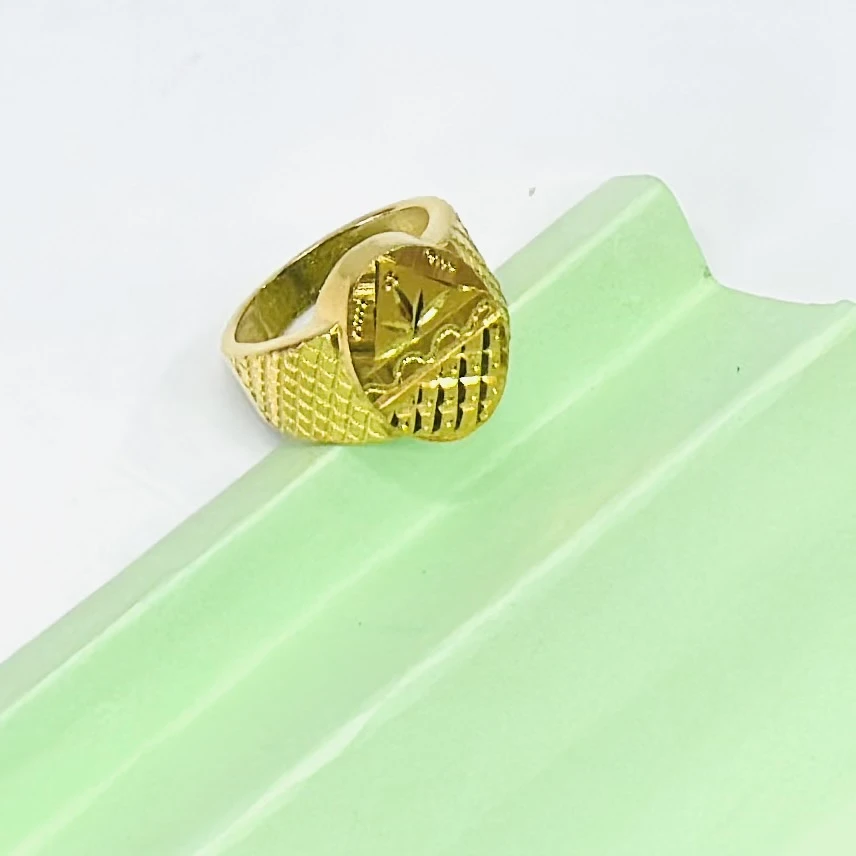 Gold plated men's ring with a cross design.