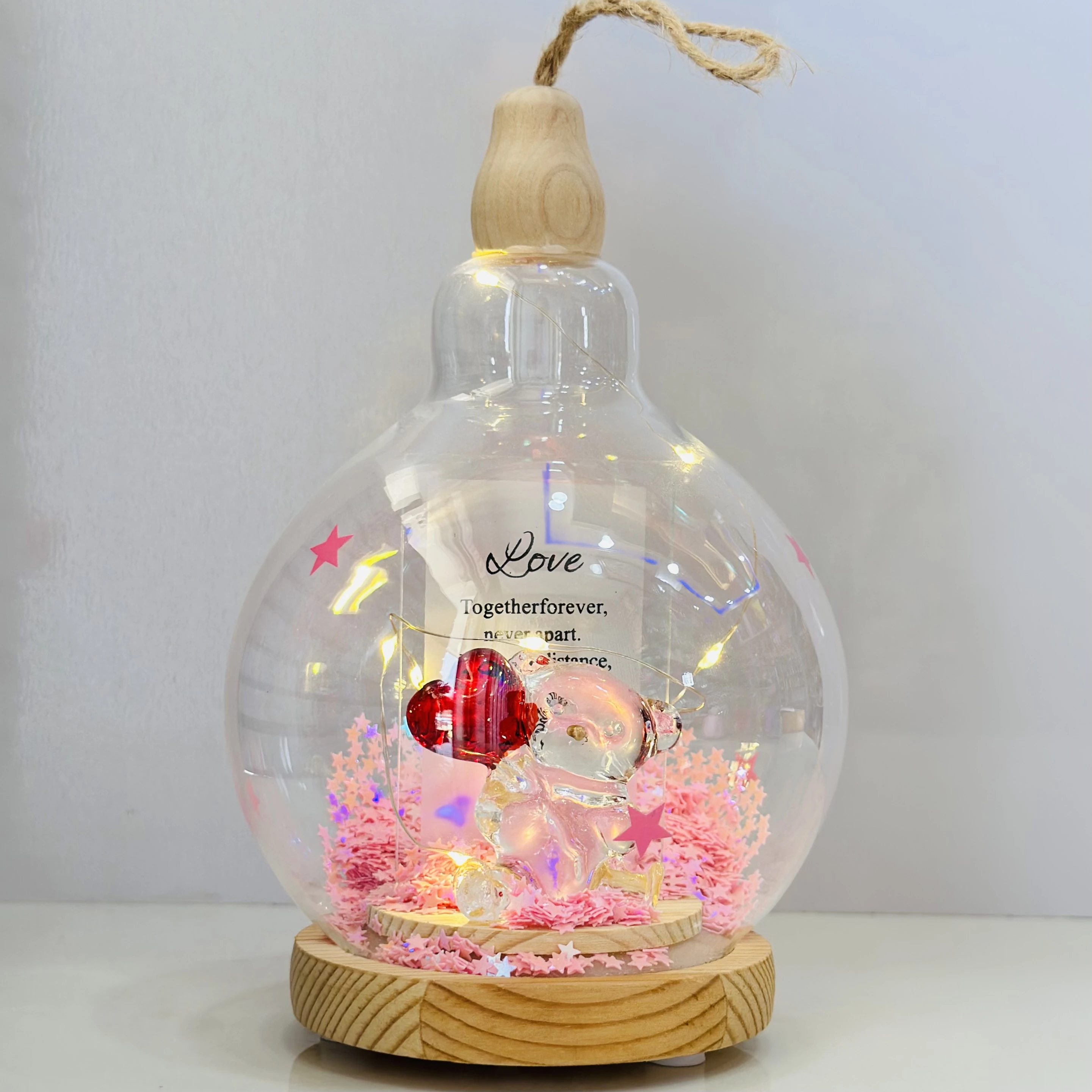 decorative glass dome with LED lights, featuring a couple figurine inside.(SKU-5NELVH)