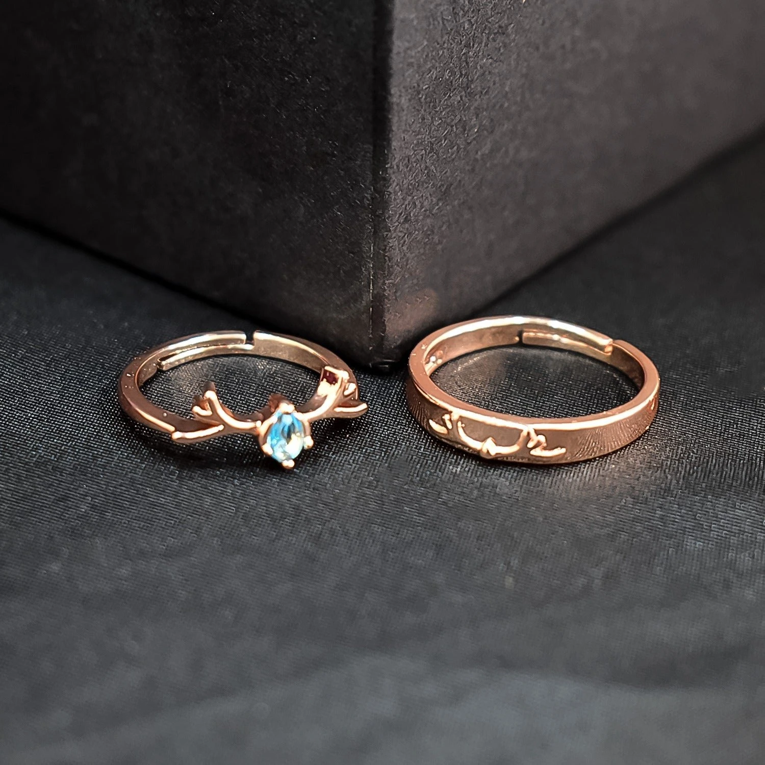 Rose gold nature-inspired wedding bands featuring a plain band and a twig branch ring