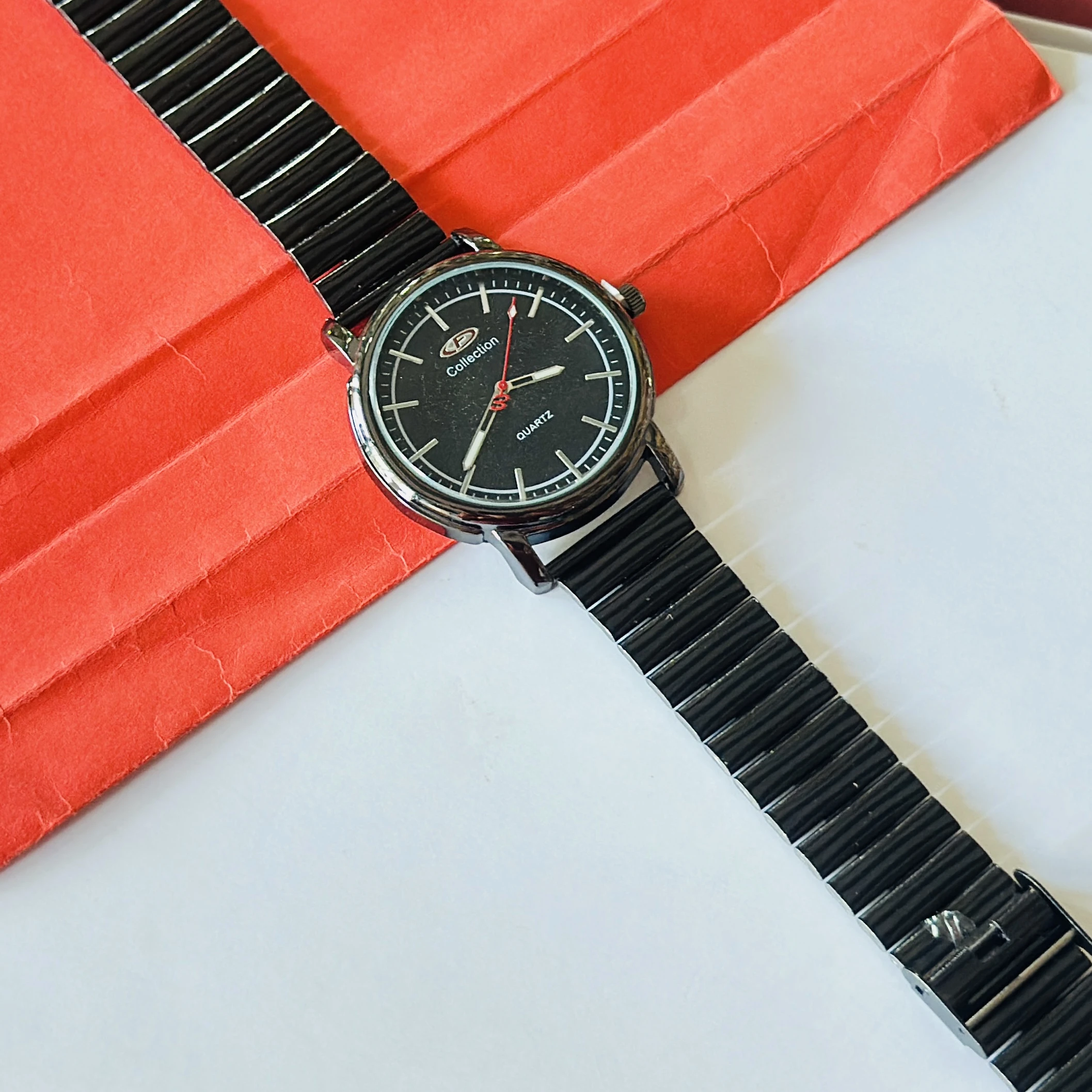 Limestone brand analog wrist watch featuring a black dial and a black band