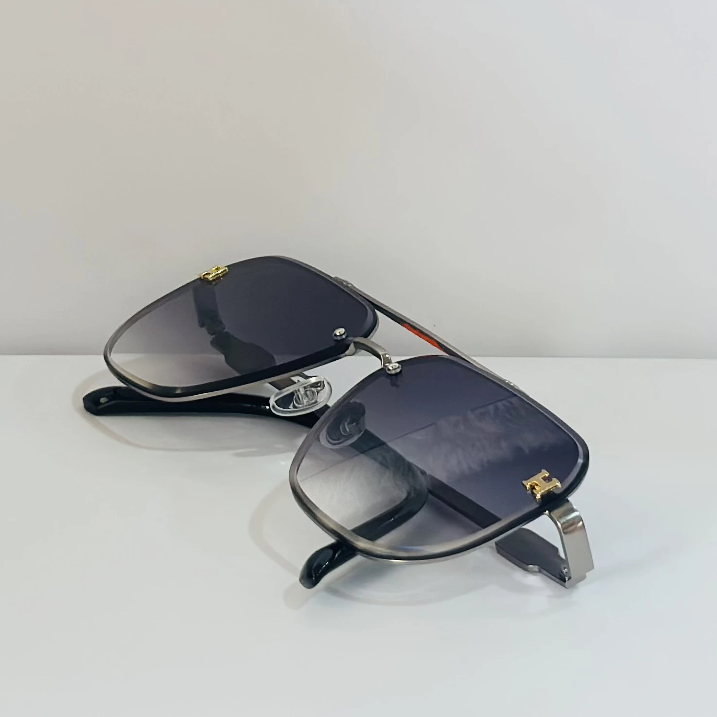 pair of Maybach aviator sunglasses with black and gold details.
