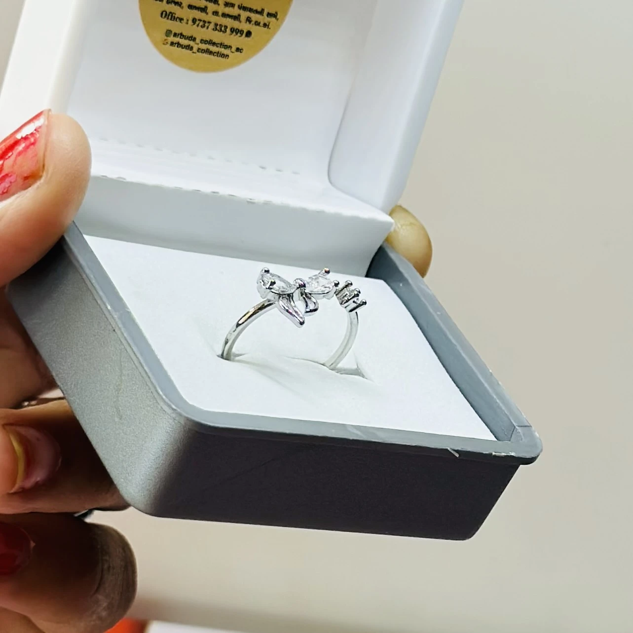 sterling silver floral ring with zircon stones.
