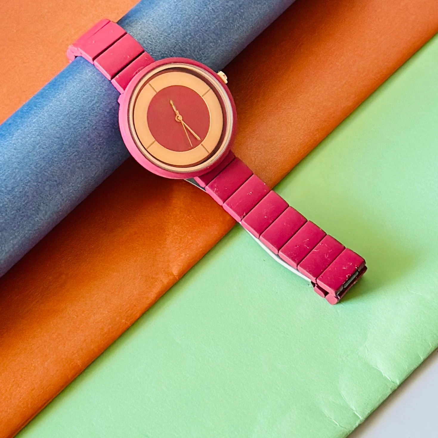burgundy or red analogue watch for women, possibly from brands like Fastrack or Watchstar