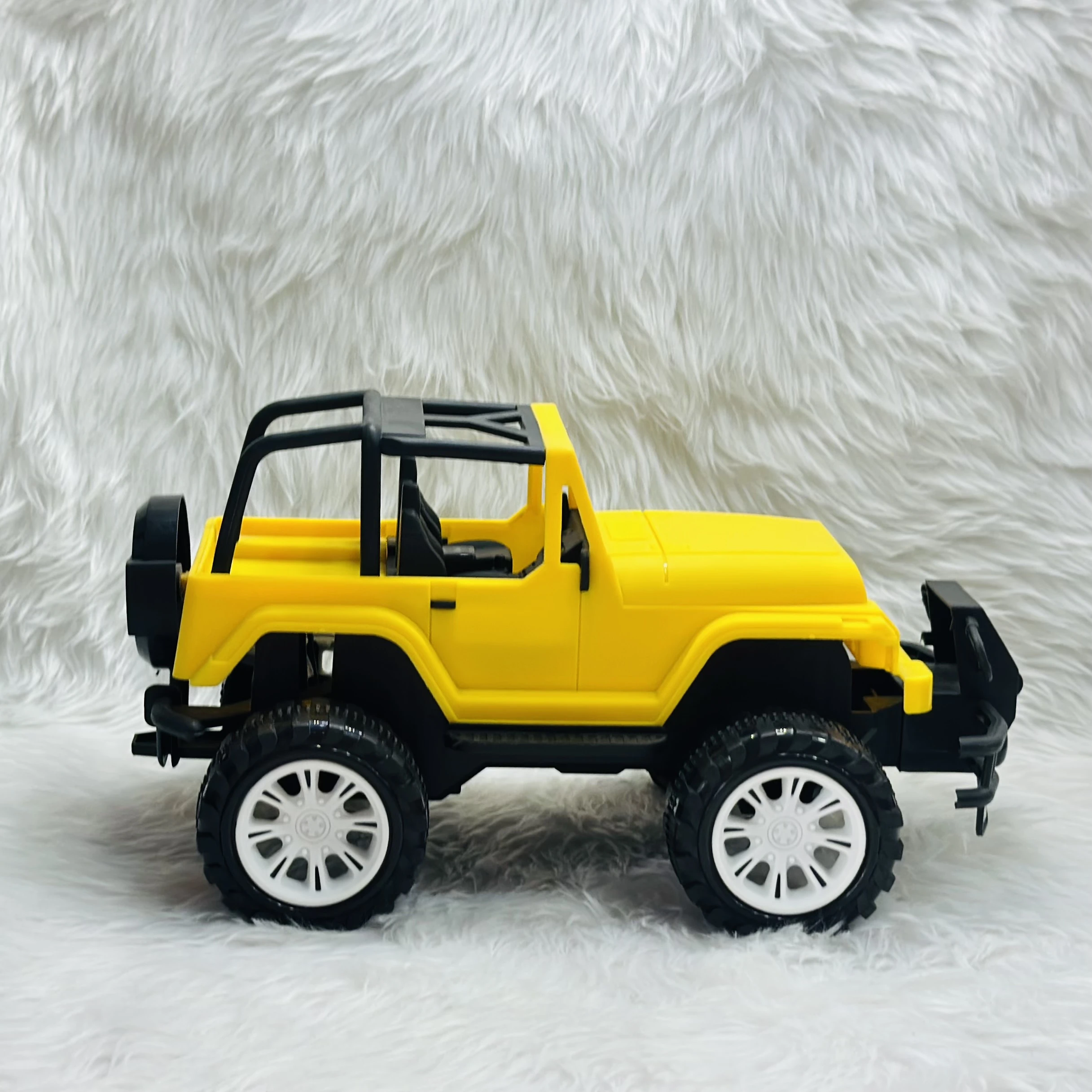 Yellow plastic toy jeep