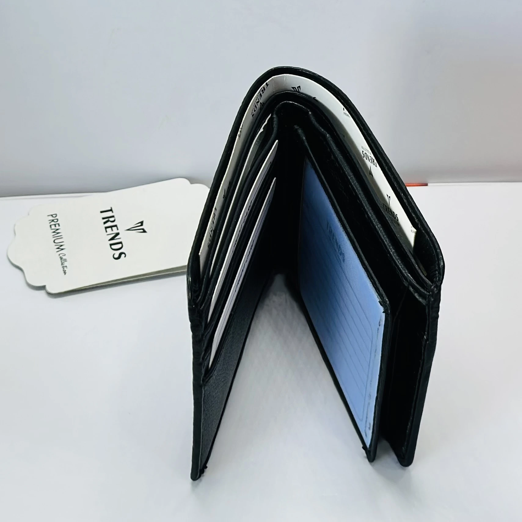 TRENDS black formal bi-fold wallet for men.
