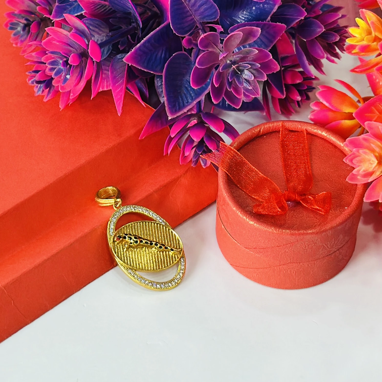 Gold plated pendant featuring a jaguar design.