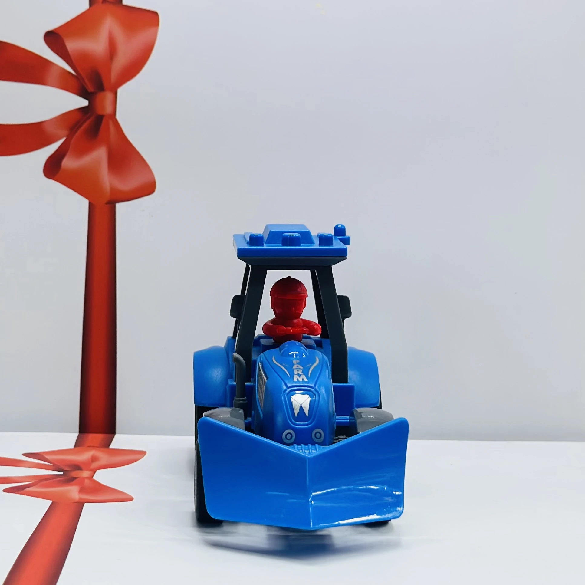 Blue plastic toy tractor