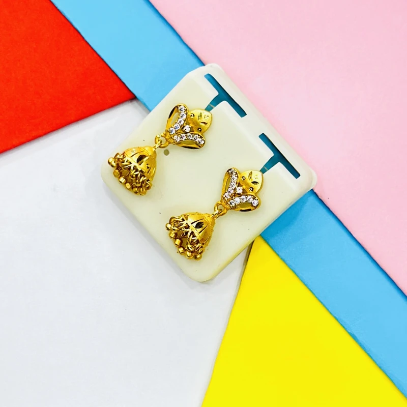 pair of ornate gold jhumka earrings