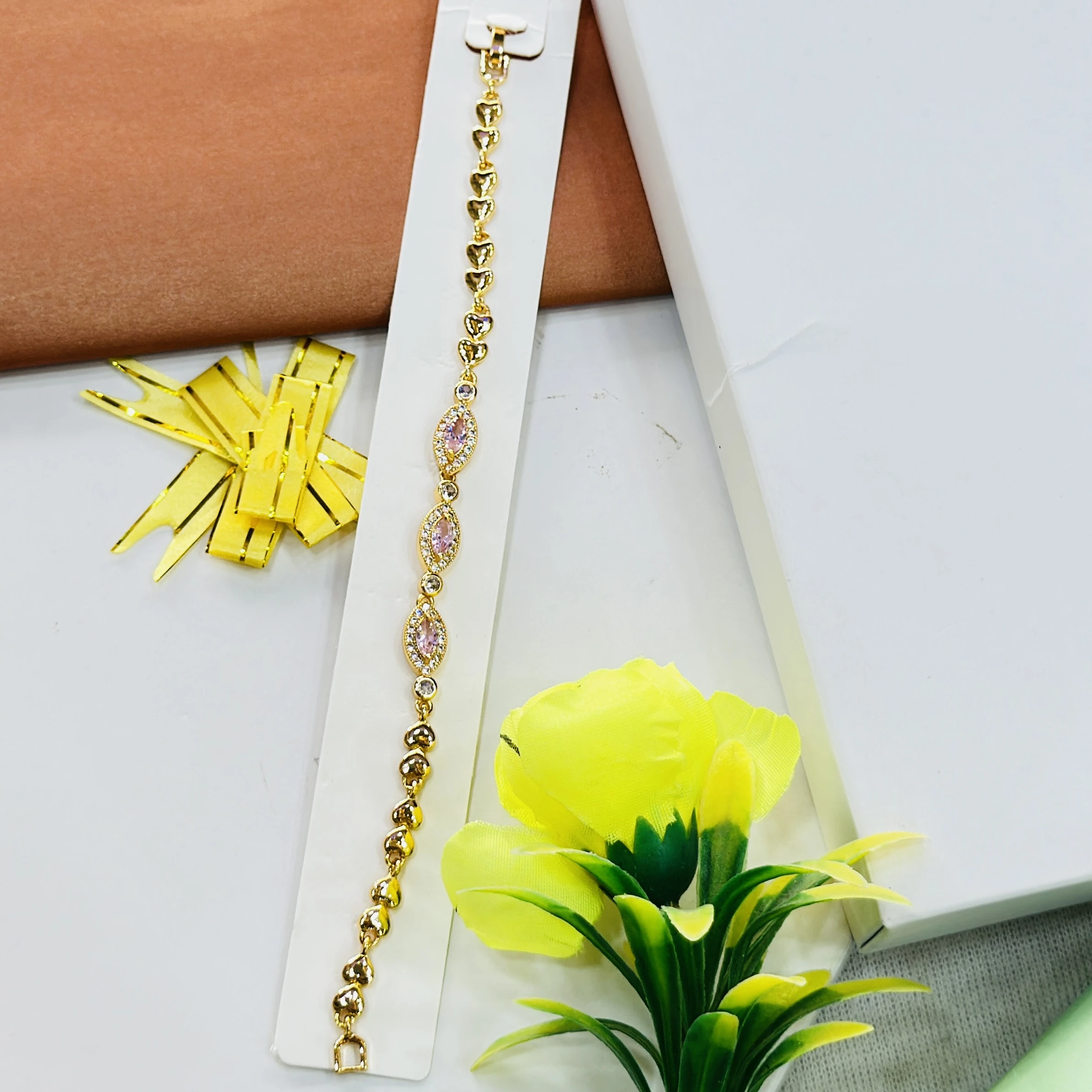 gold-plated bracelet featuring small heart-shaped links